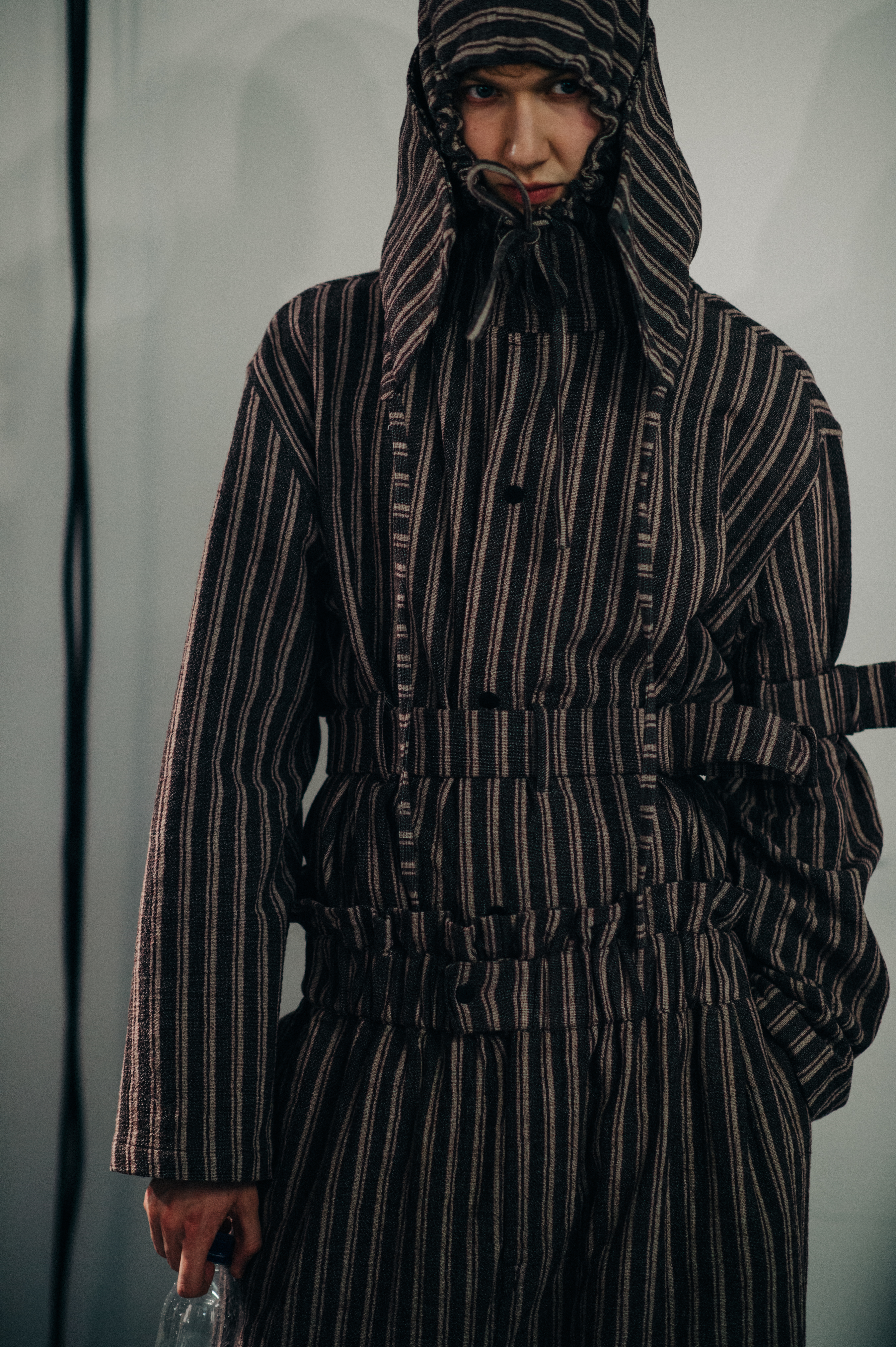 Male model wearing striped outfit