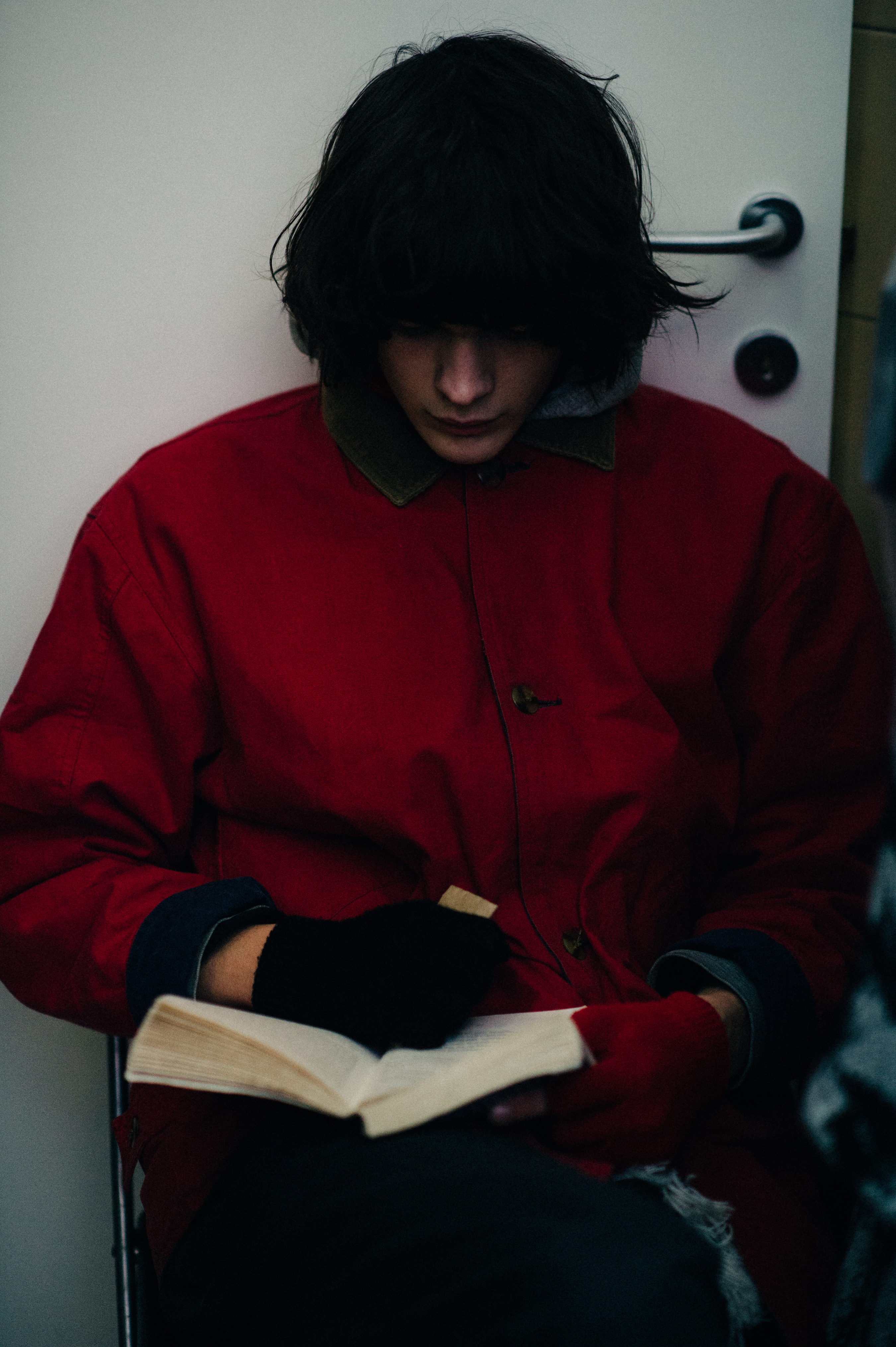 Male model reading backstage