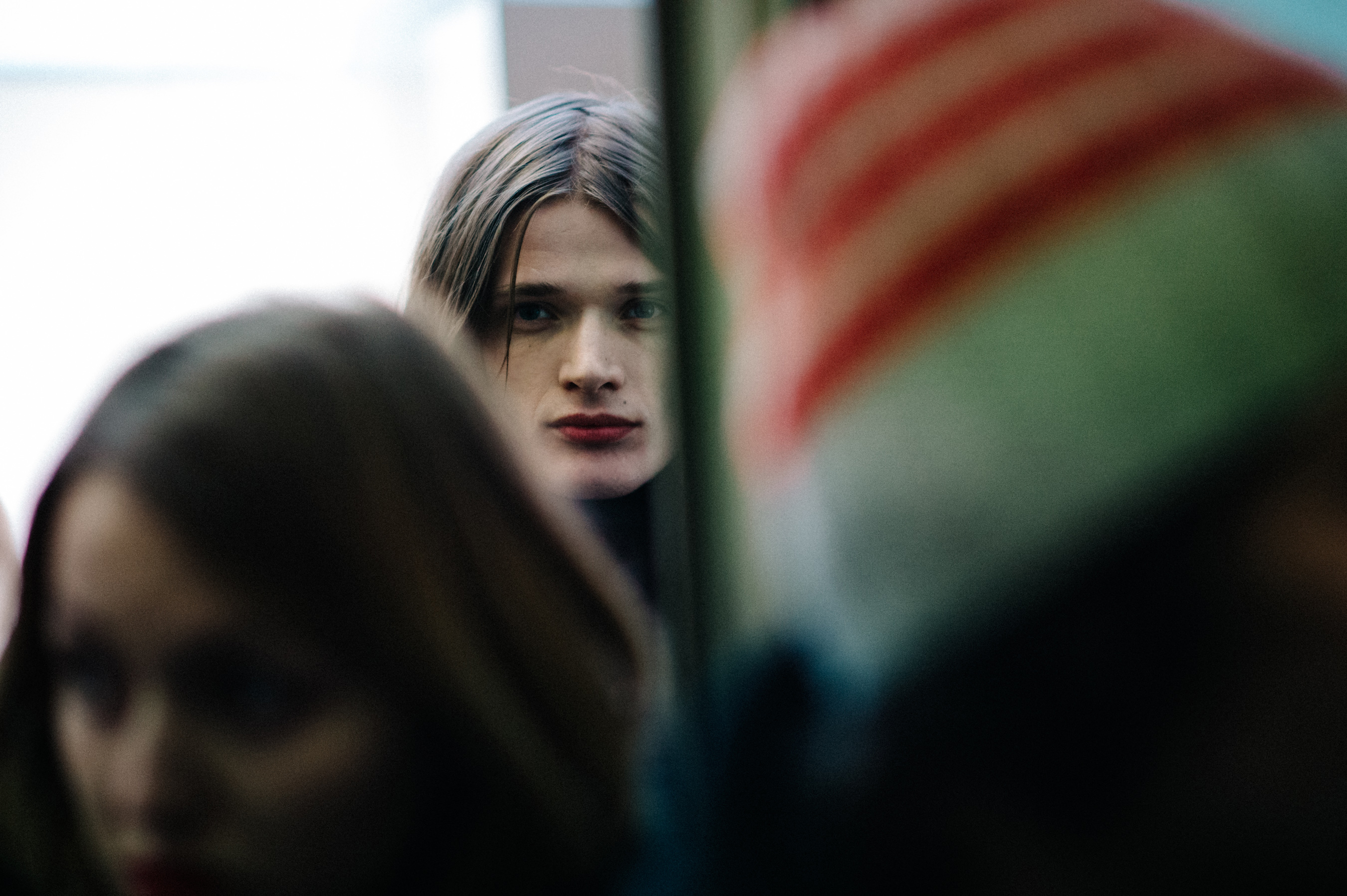 Male model looking through the crowd