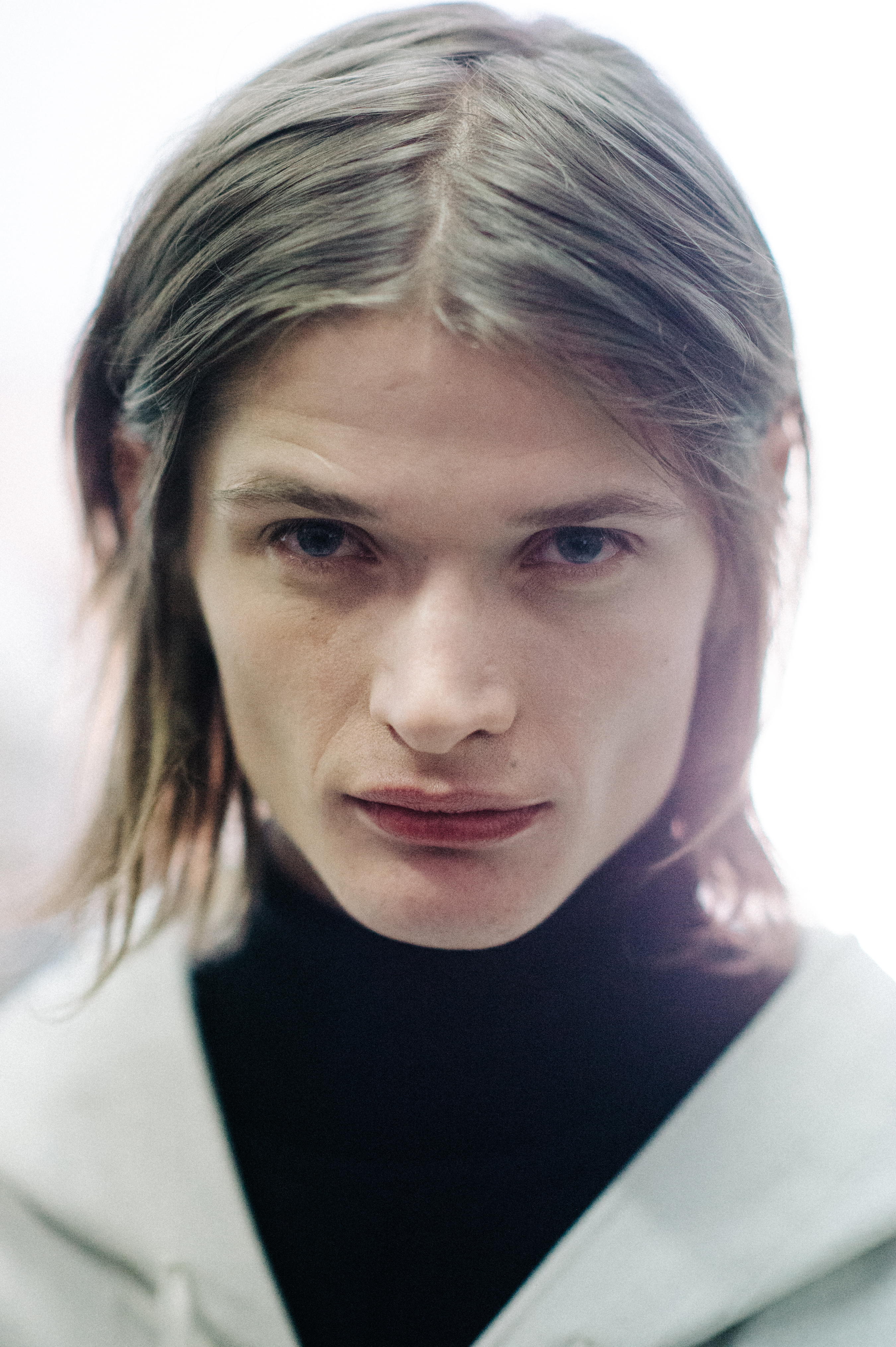 Portrait of a male model wearing white