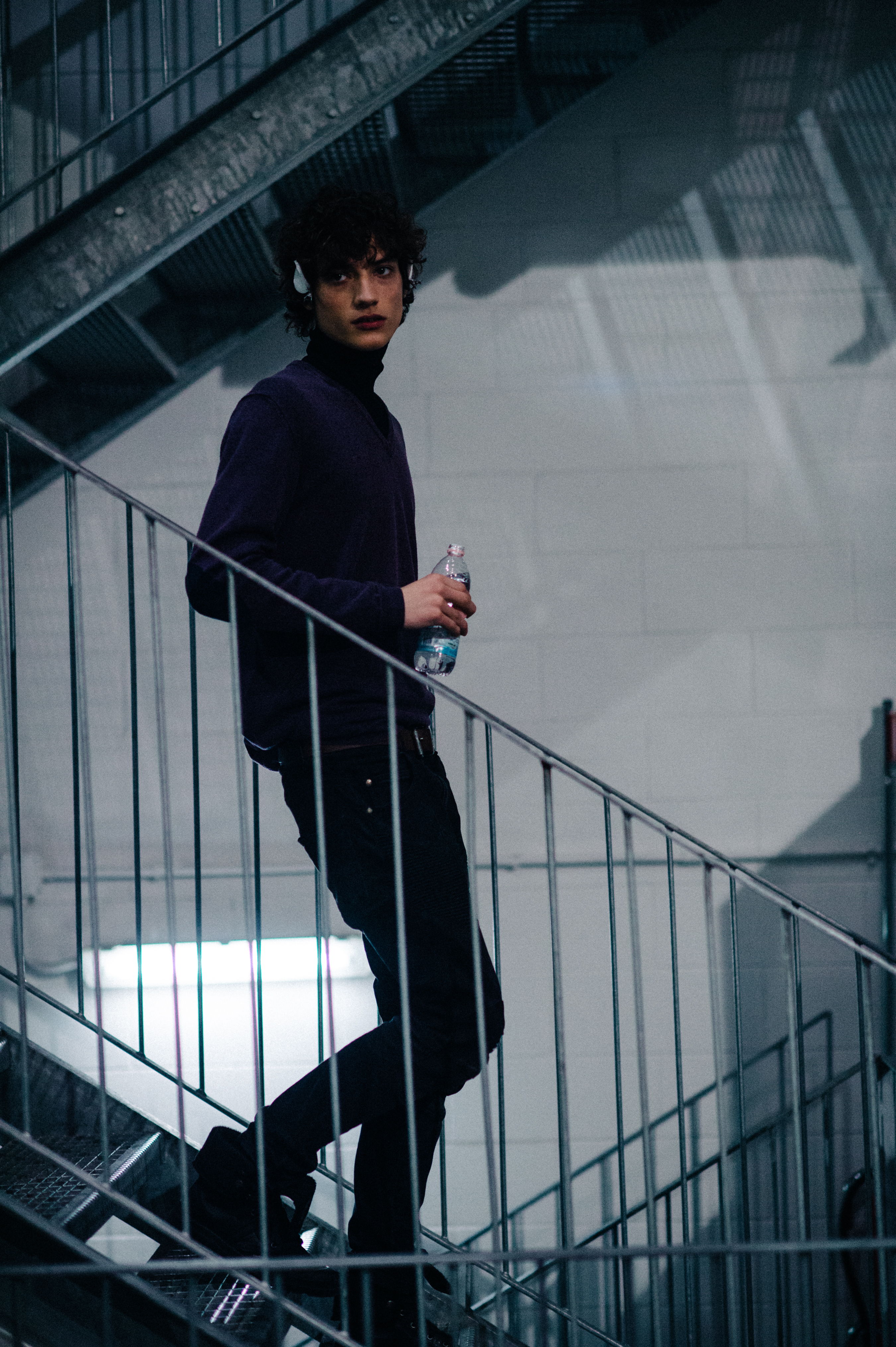 Austrian male model walking down the stairs