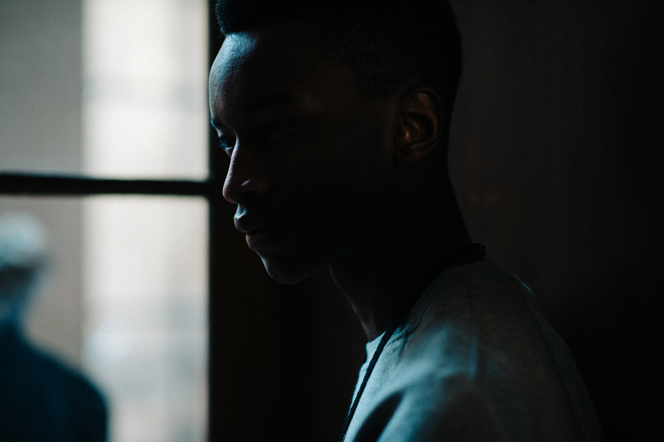 Male model next to window