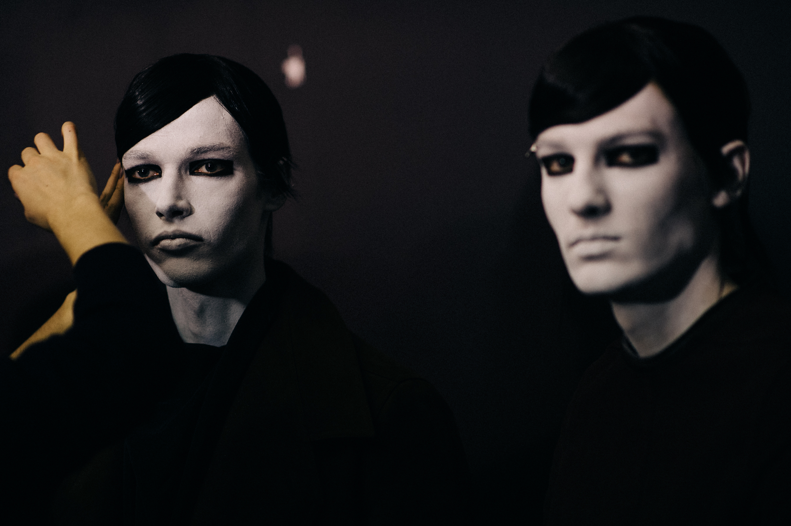 Male models white face before the show