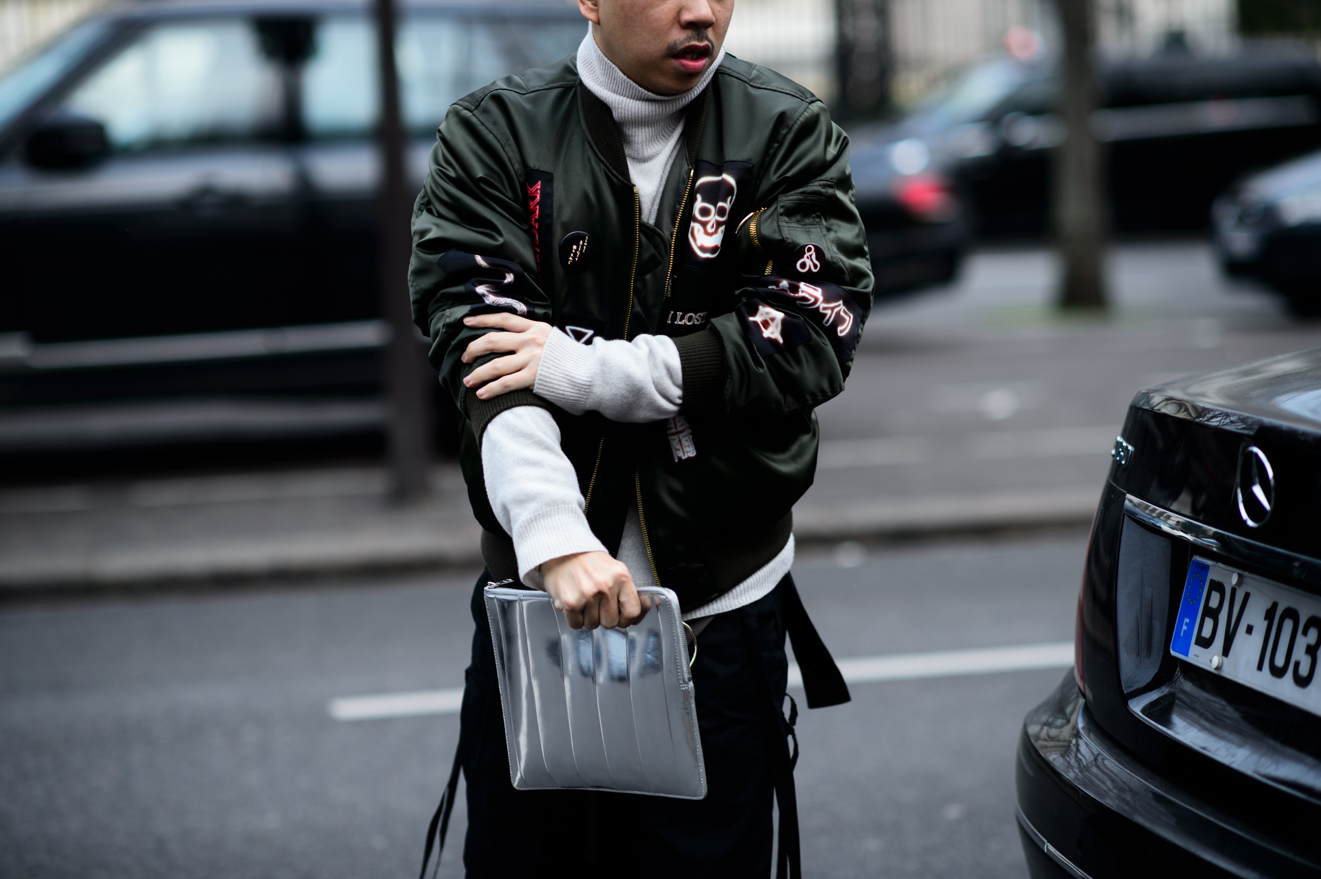 Man wearing green bomber