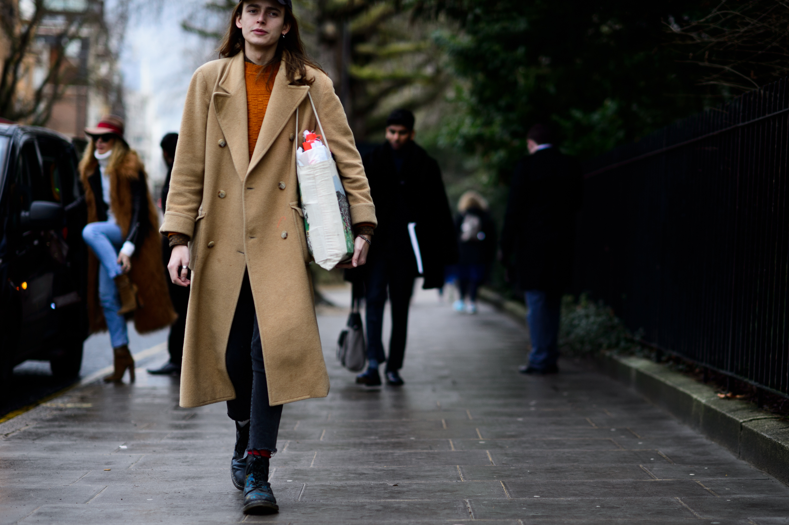 Man wearing beige coat