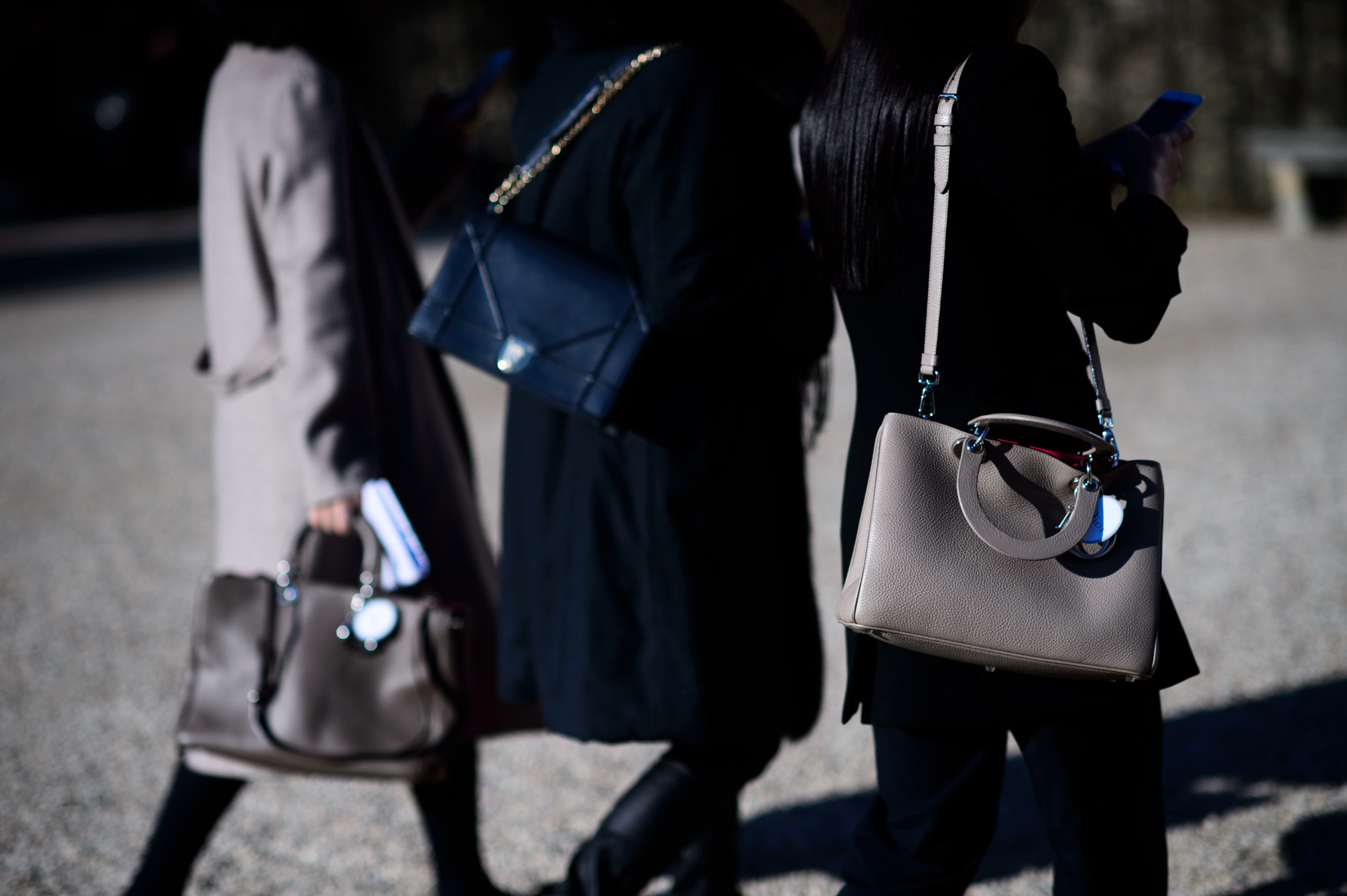 Three women with Dior bags