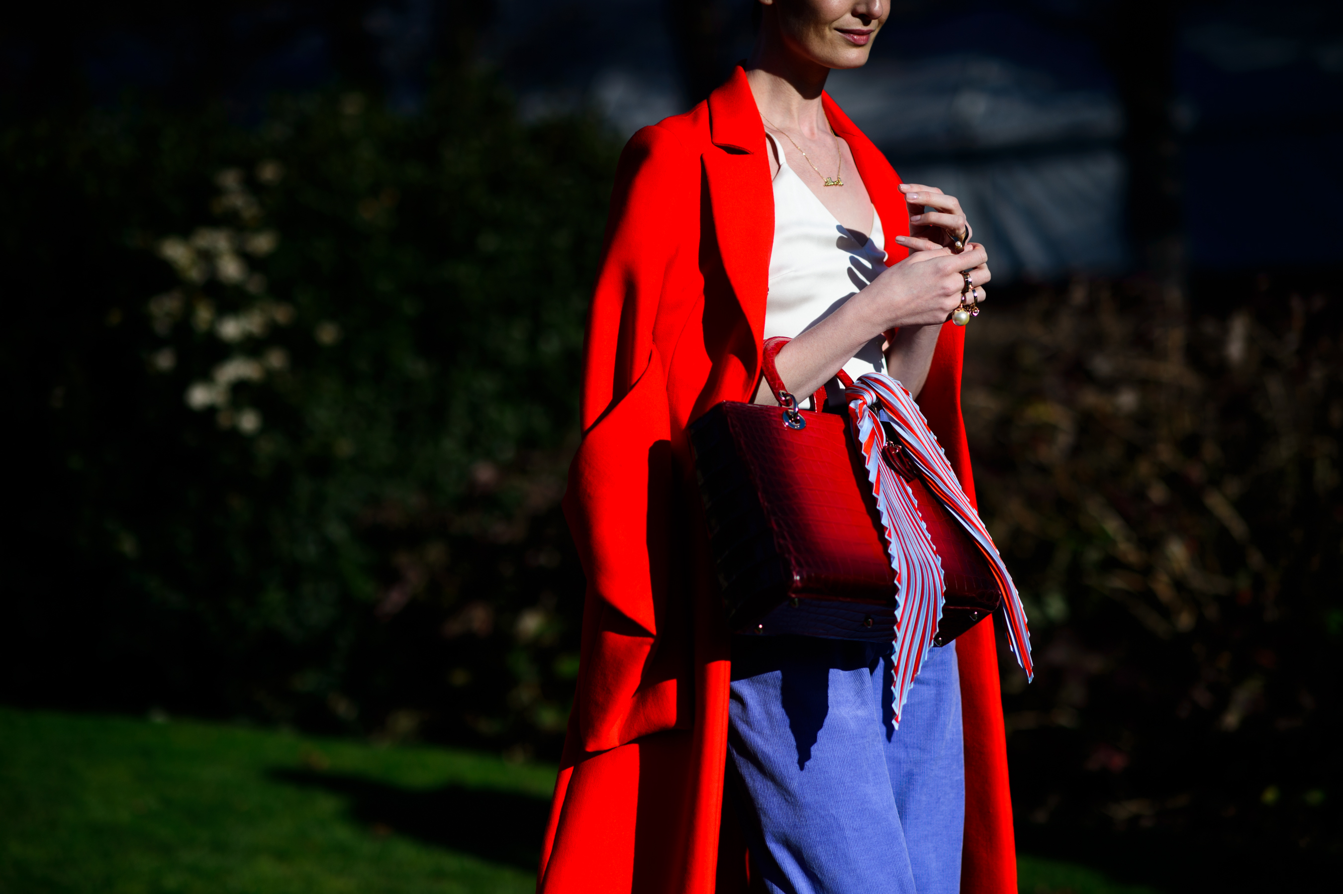 Woman wearing red coat before show