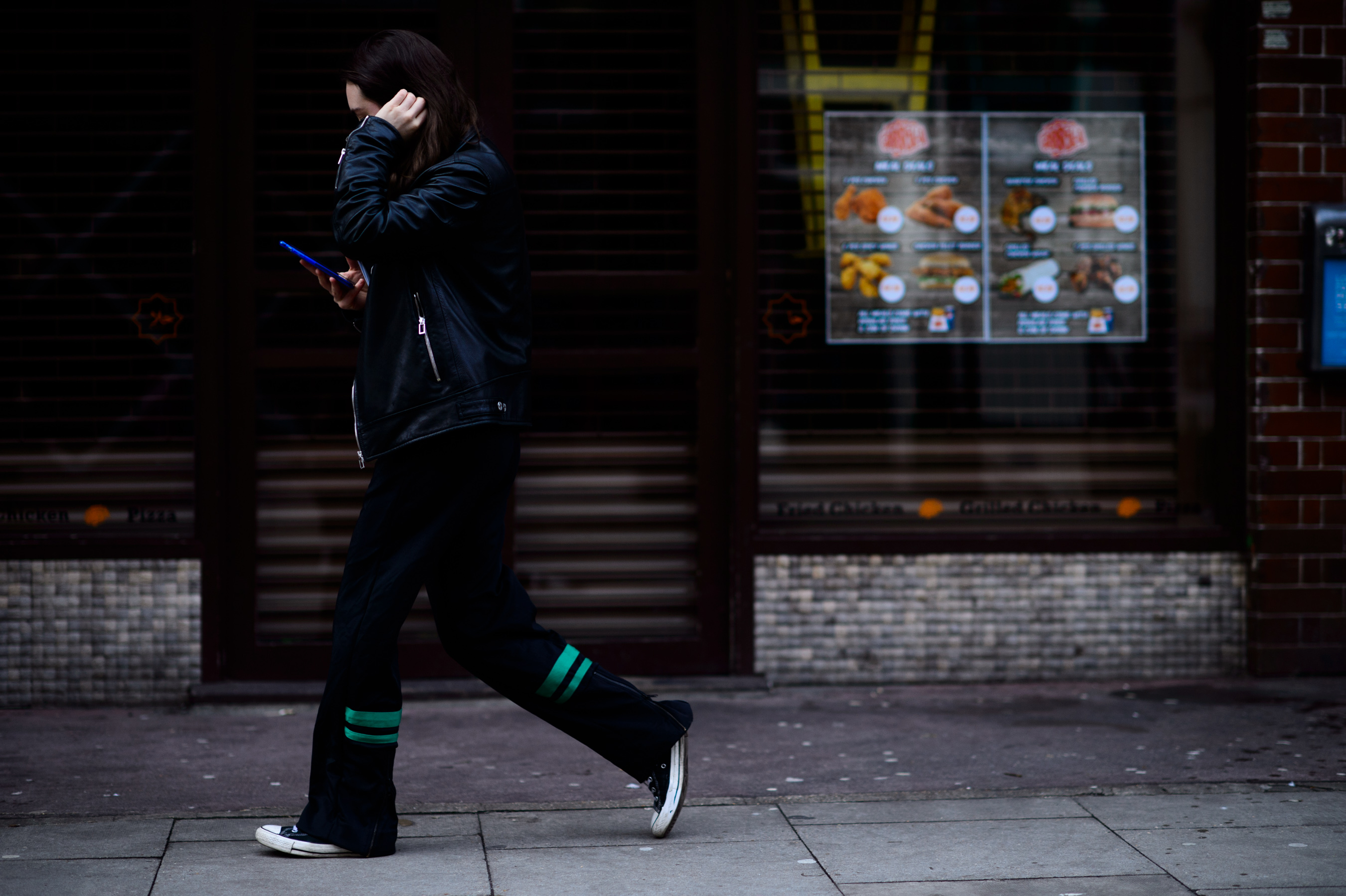 Woman wearing pants with green detail