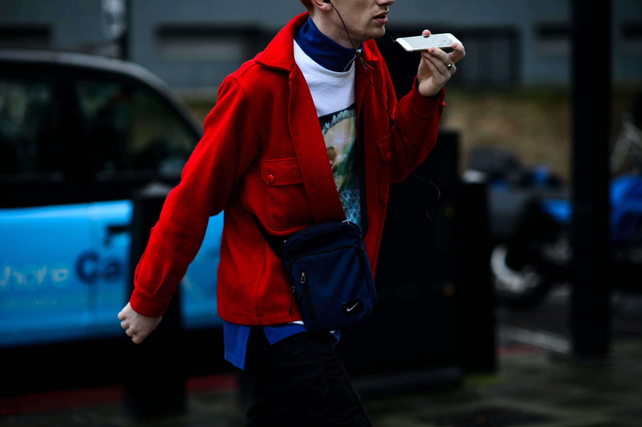 Man wearing red Gosha Rubchinskiy jacket