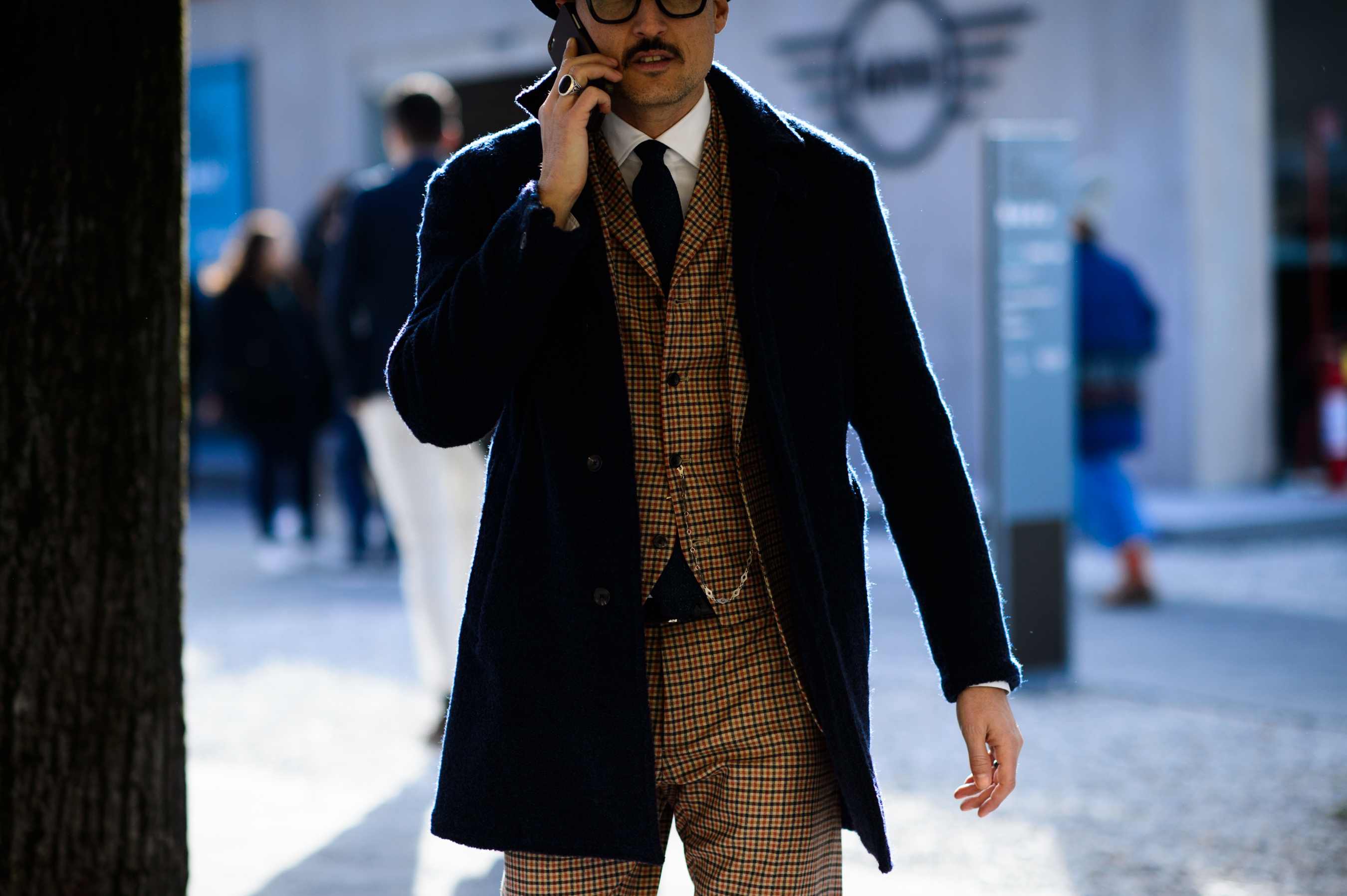 Italian man wearing suit and coat