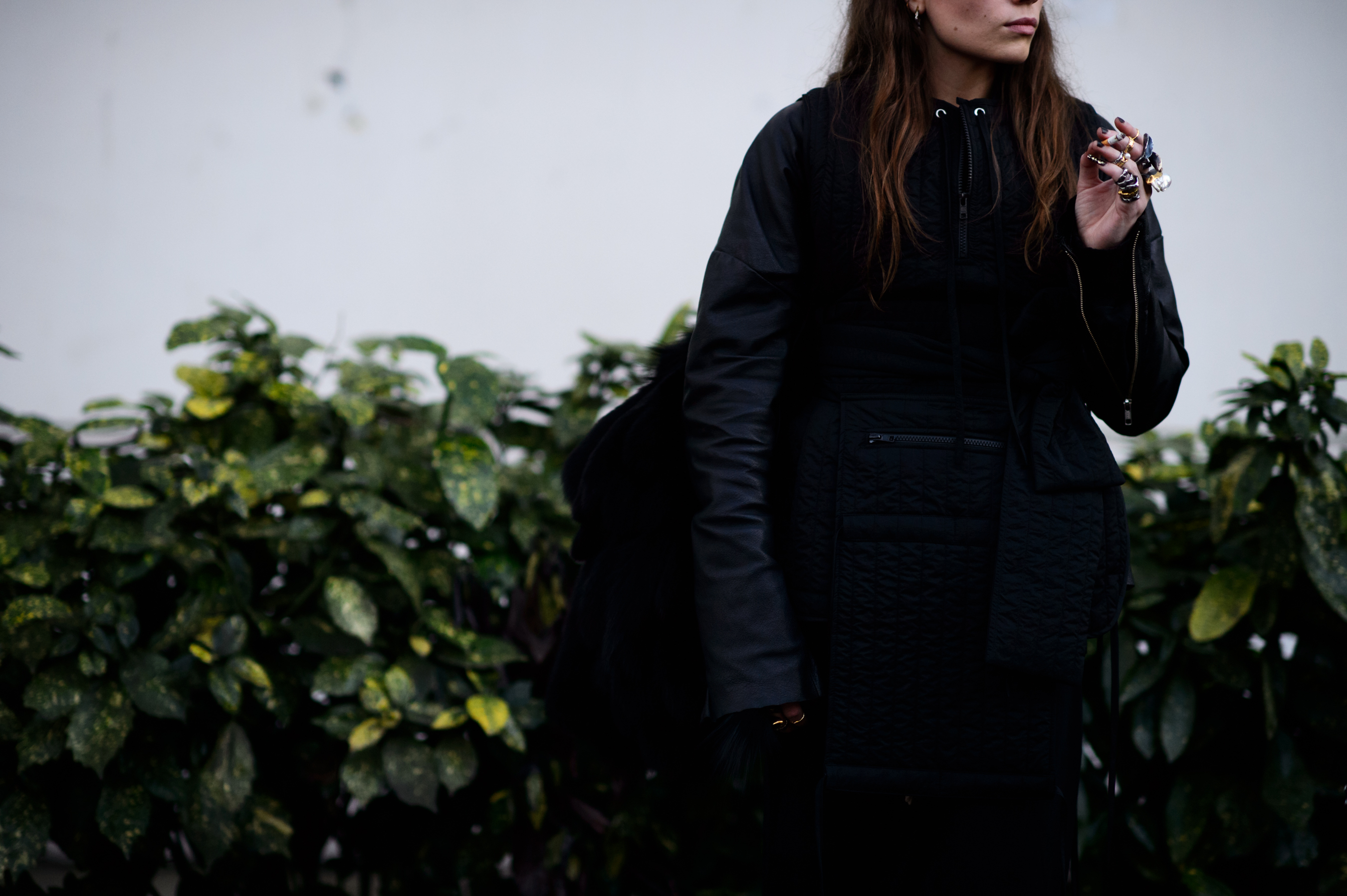Woman wearing black and rings