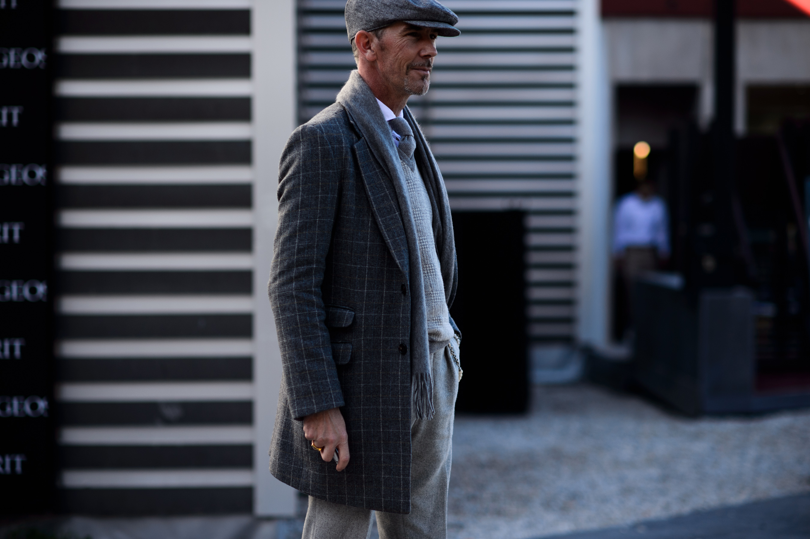 Italian man wearing grey outfit