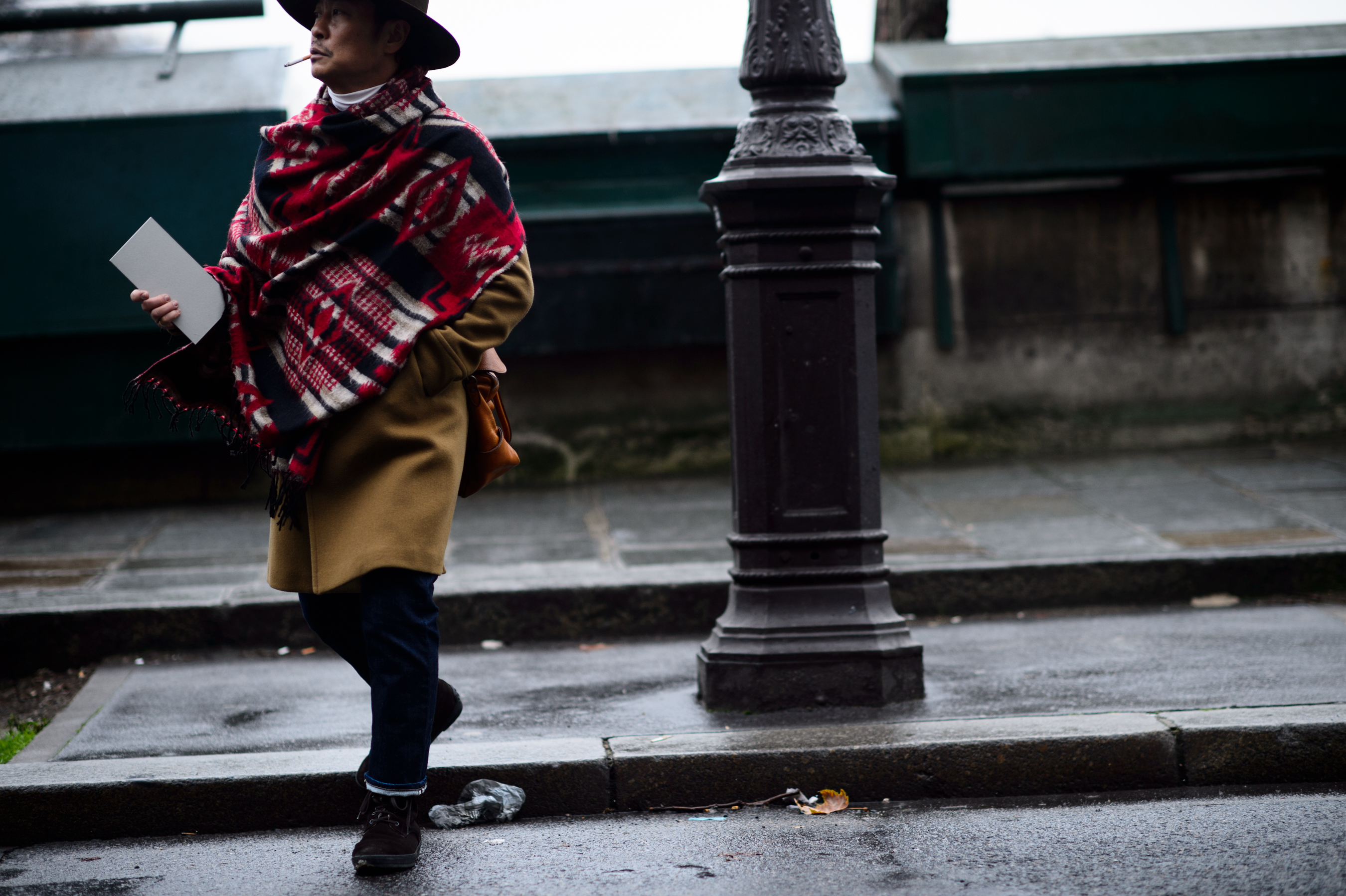 Man scarf crosses road