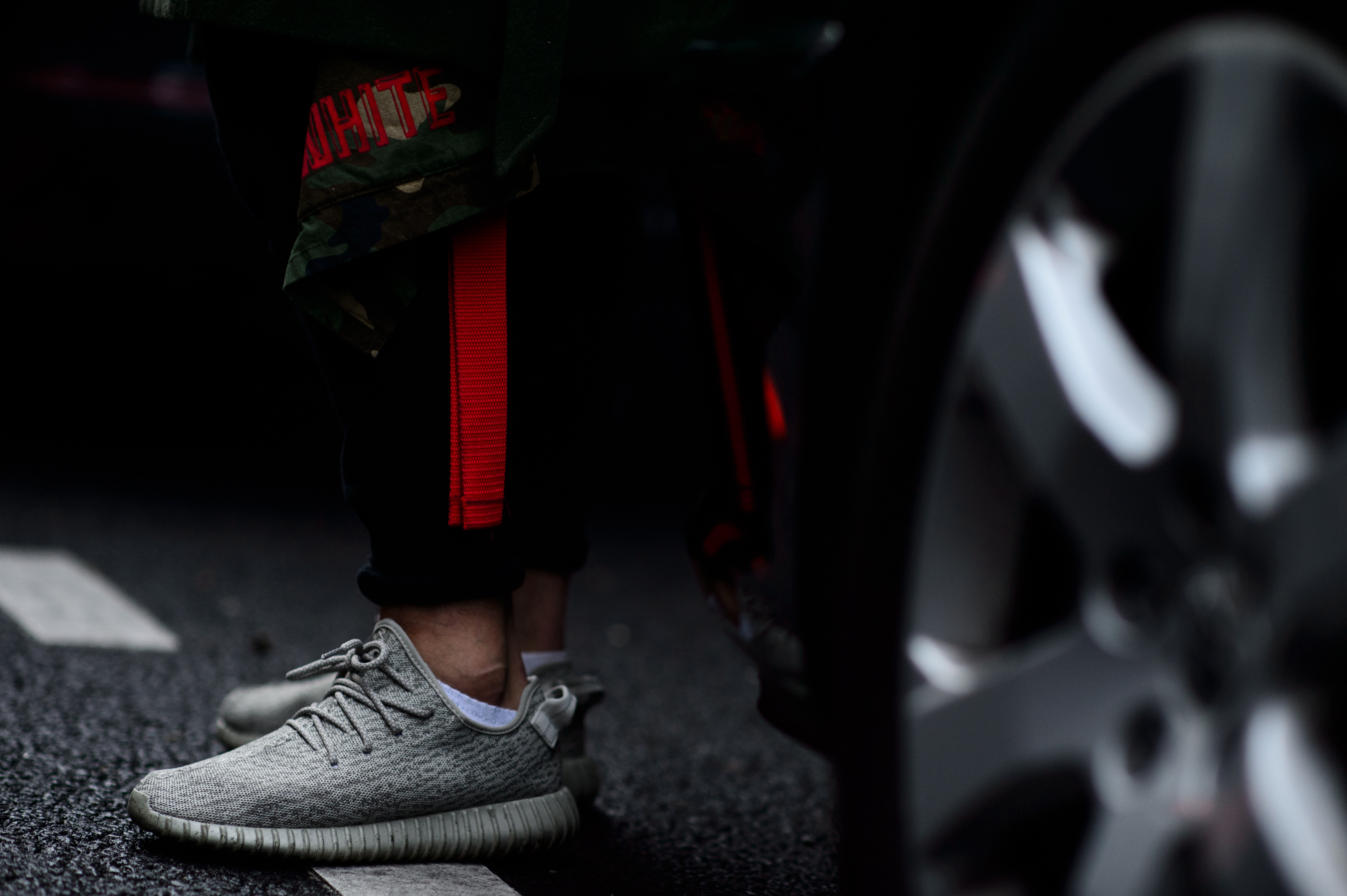 Illustrator wearing Adidas x Yeezy