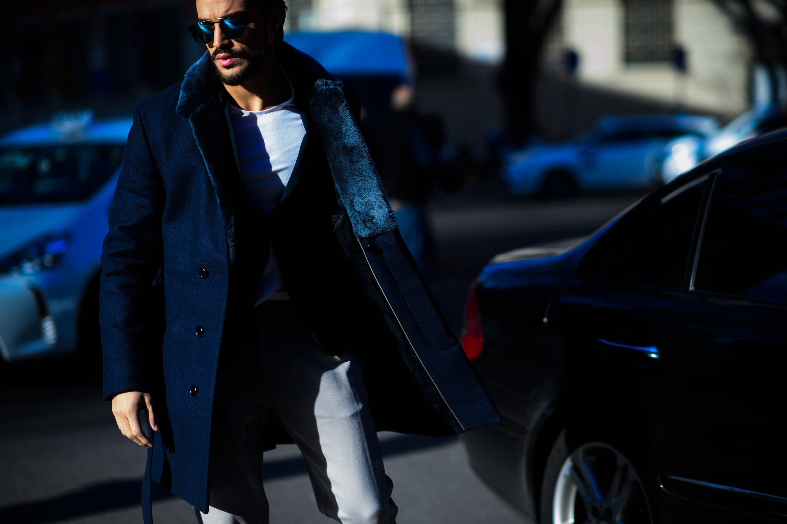 Italian male blogger wearing blue coat