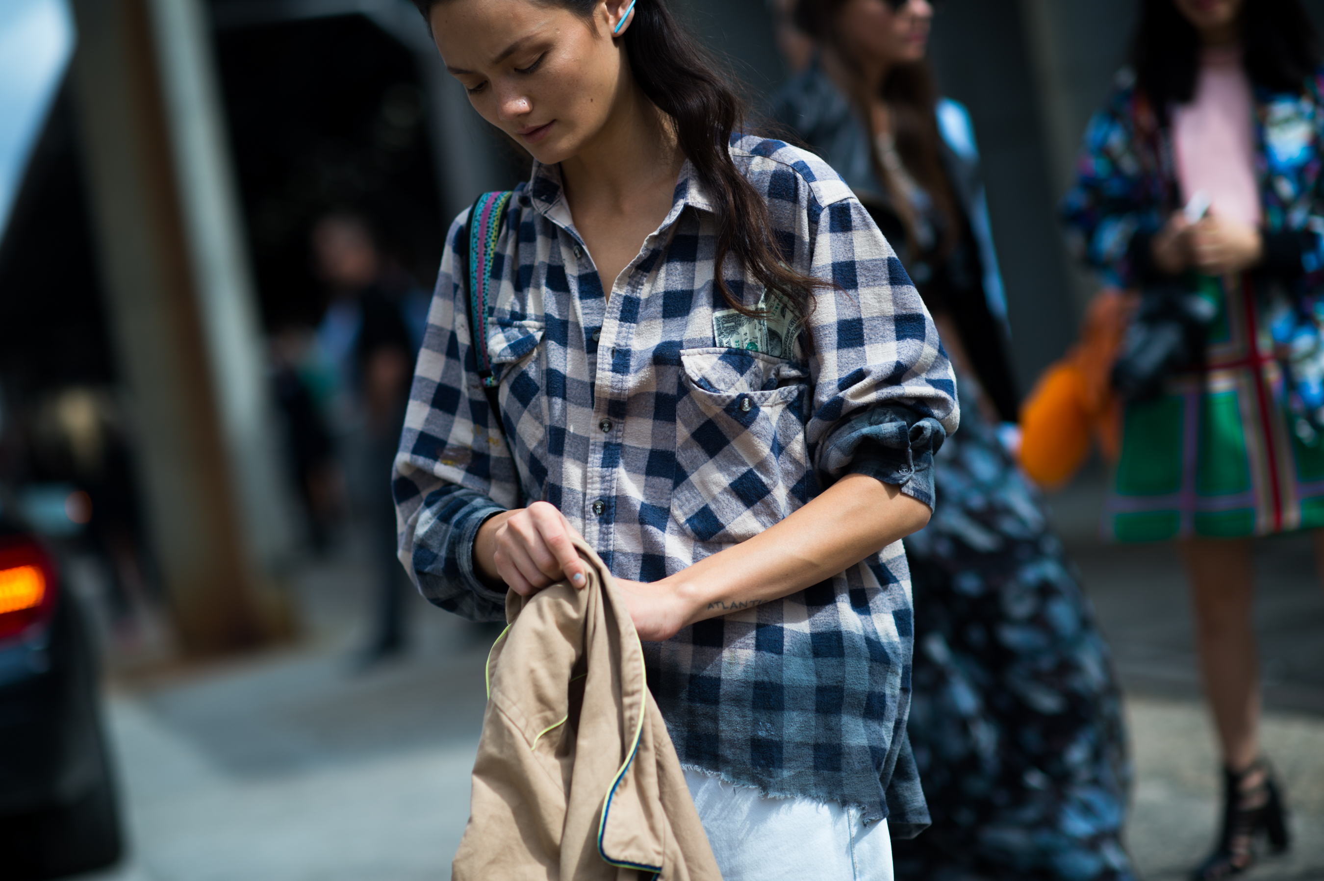 Woman wearing shirt with dollars