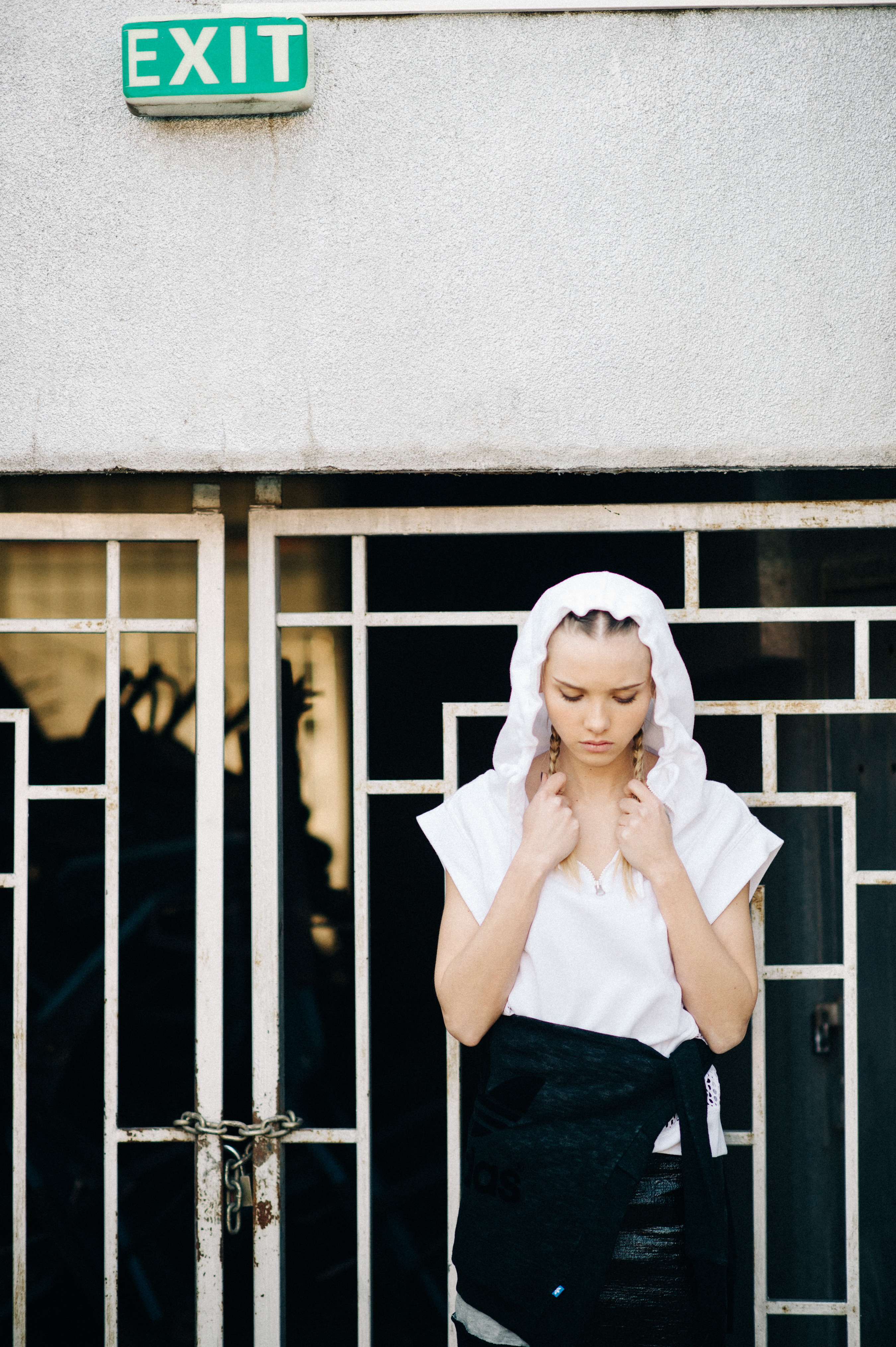 Model wearing white hood