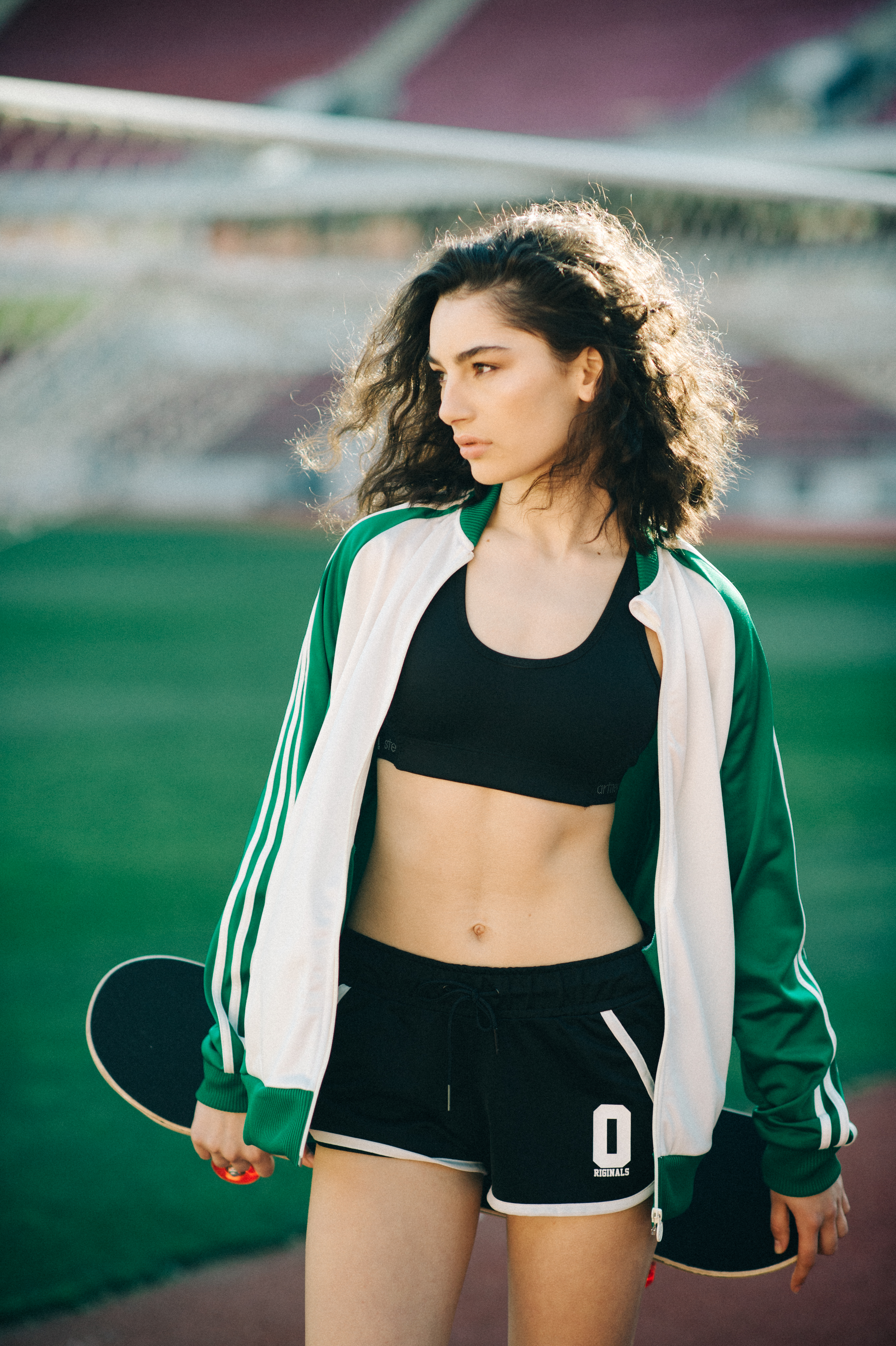 Model posing with skateboard