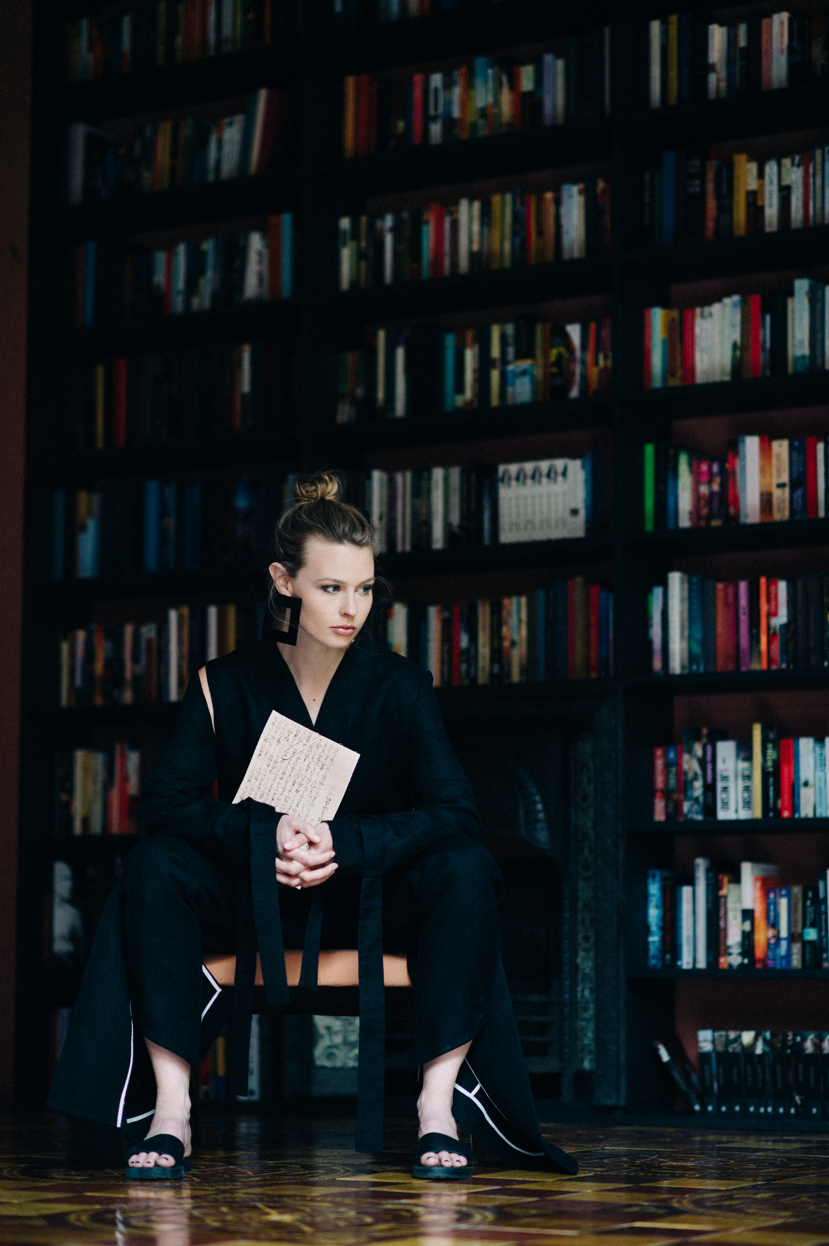 Australian blogger posing in a library