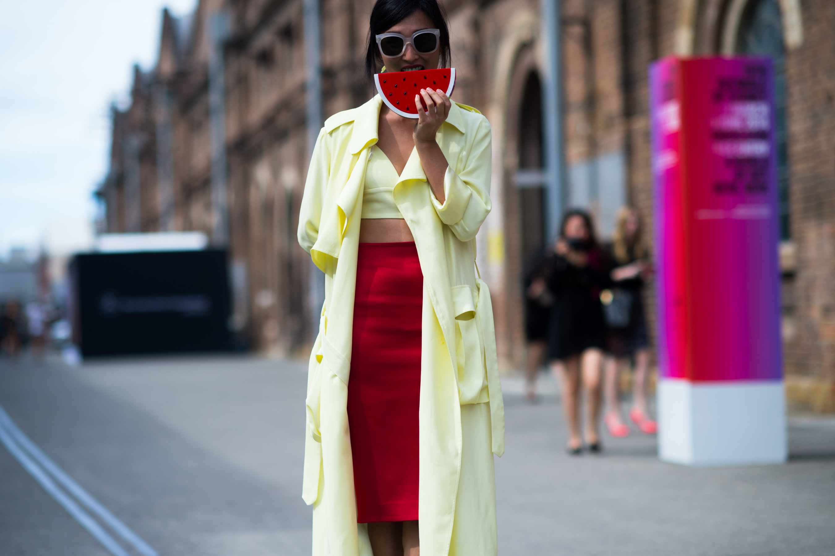Woman holding watermelon clutch