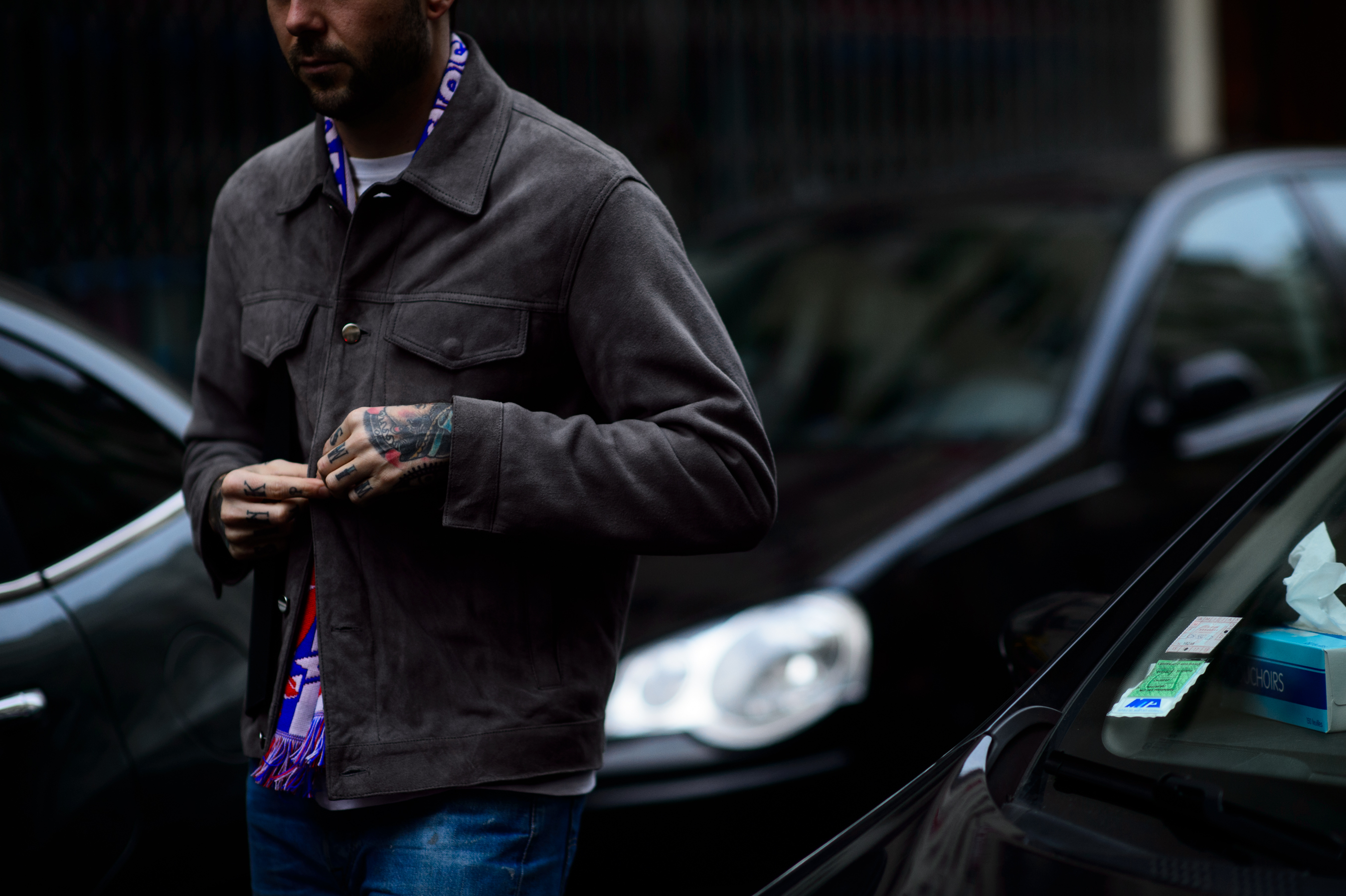 Man with tattooed hands