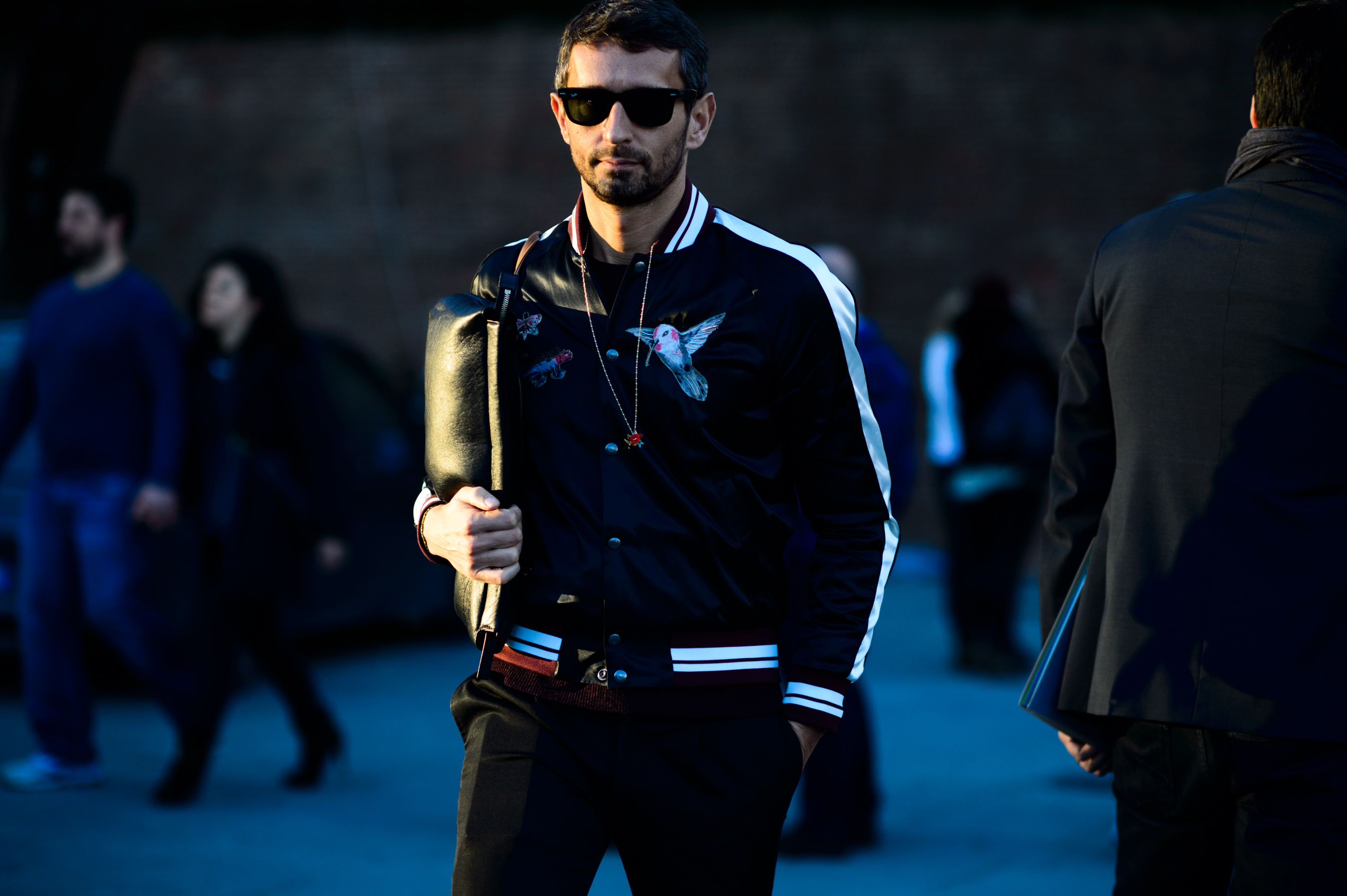 Italian journalist wearing bird bomber
