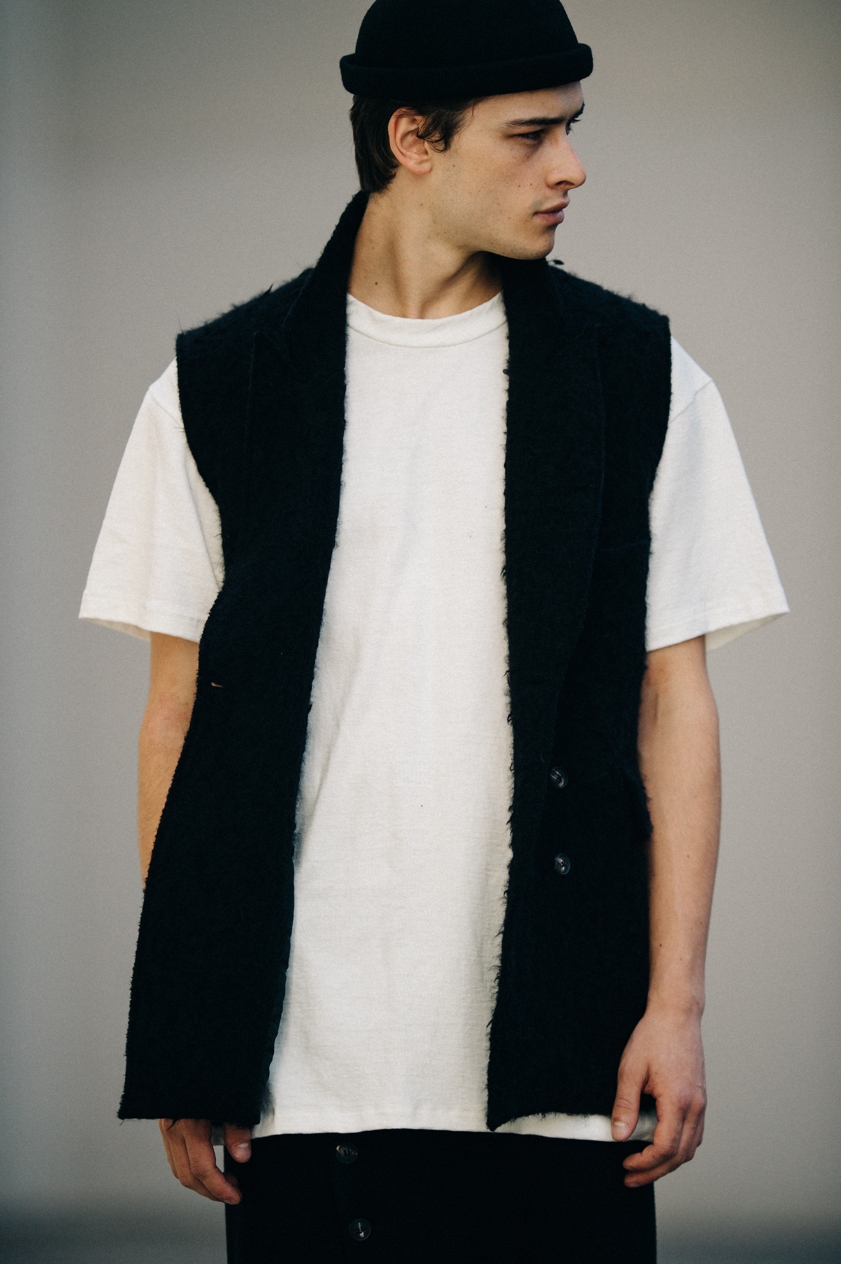 Male model wearing black and white outfit