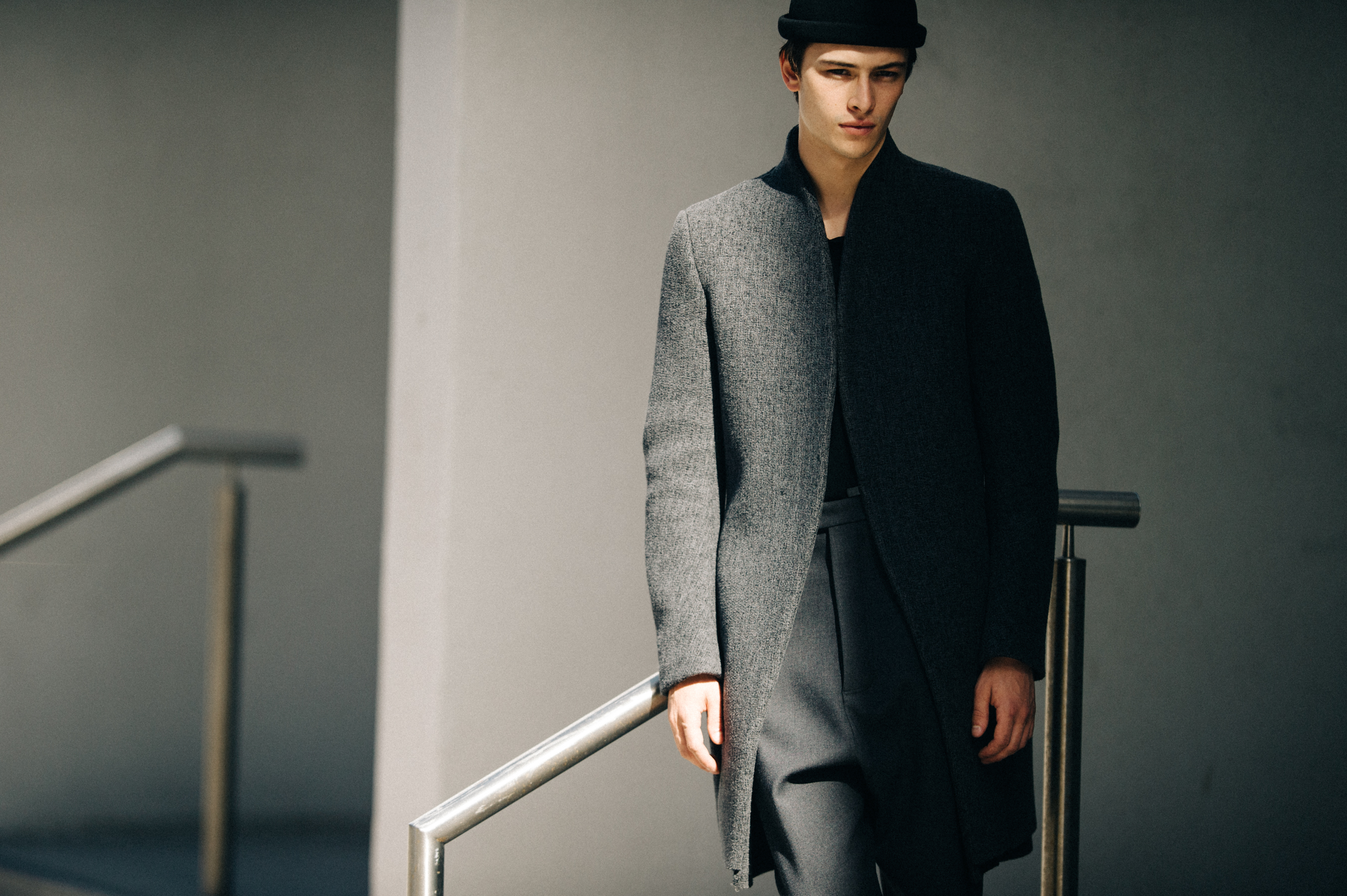 Male model wearing gray outfit