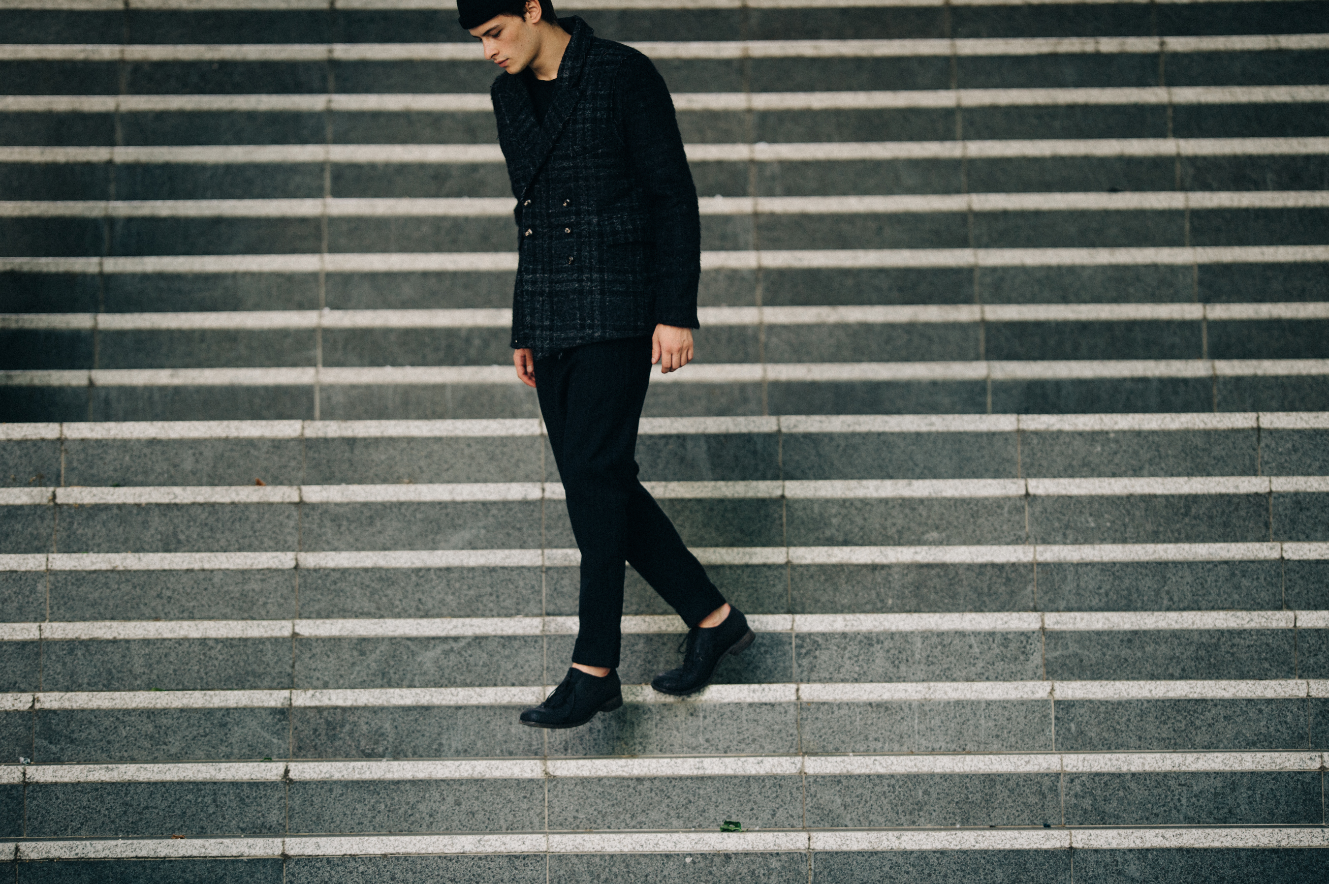 Male model wearing gray outfit