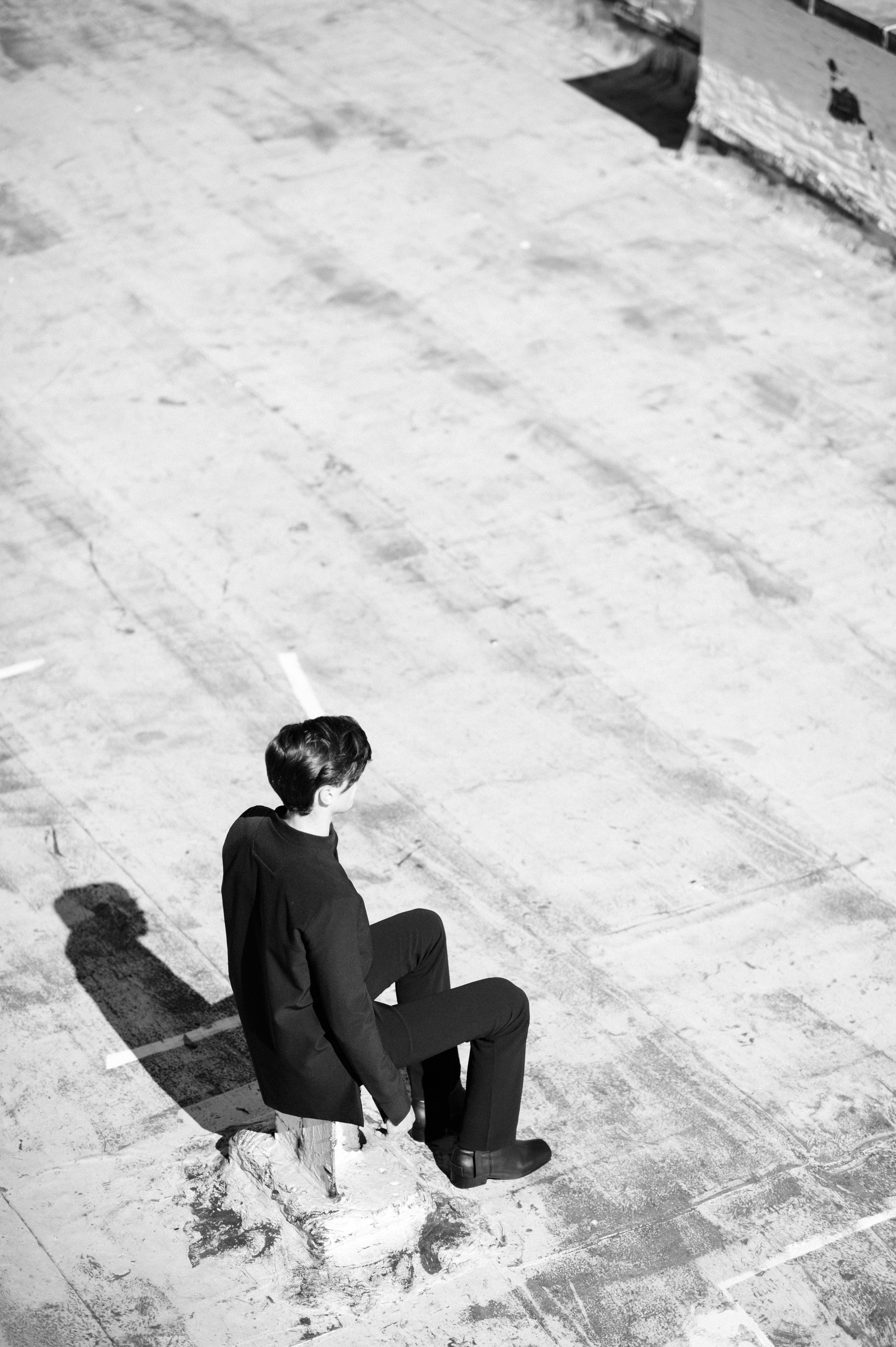 Male model sitting on the ground