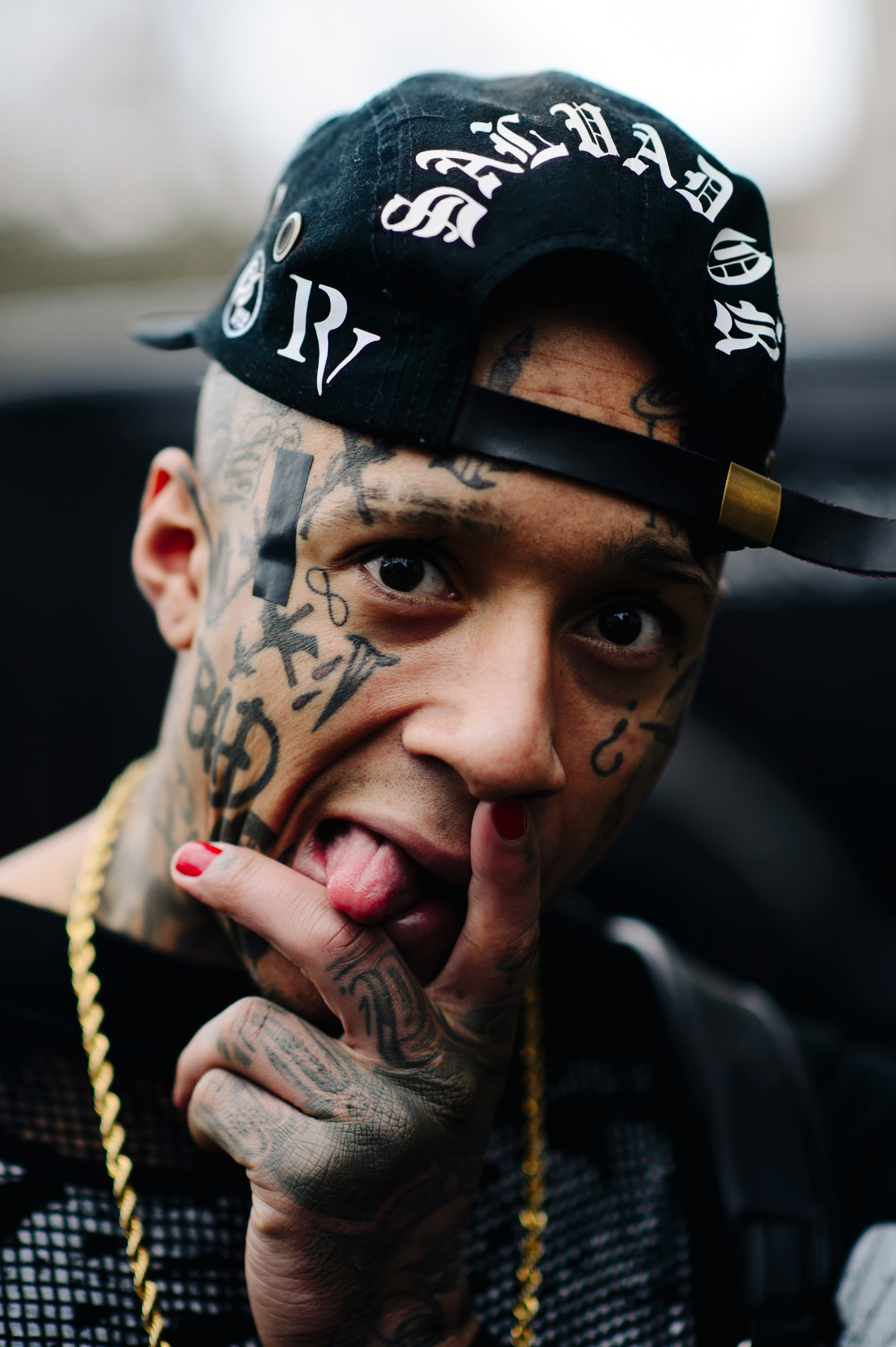 Portrait of a man with tattoos on his face