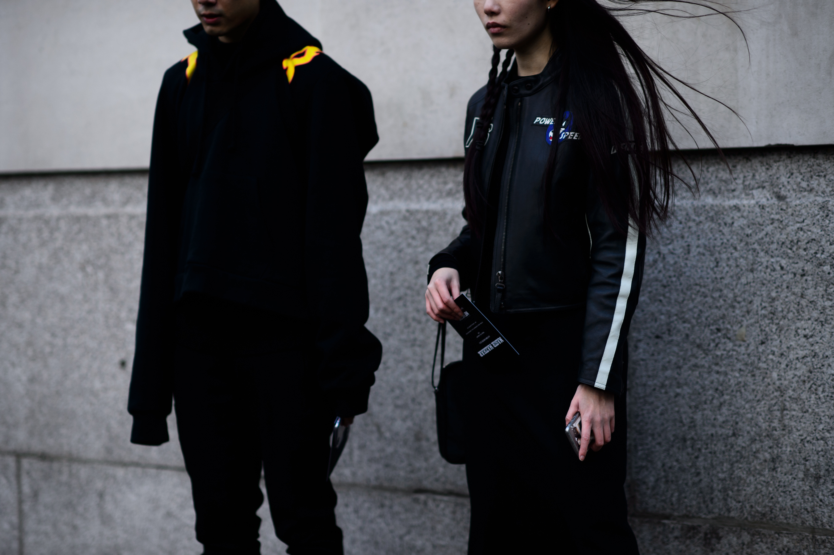 Man and women wearing black
