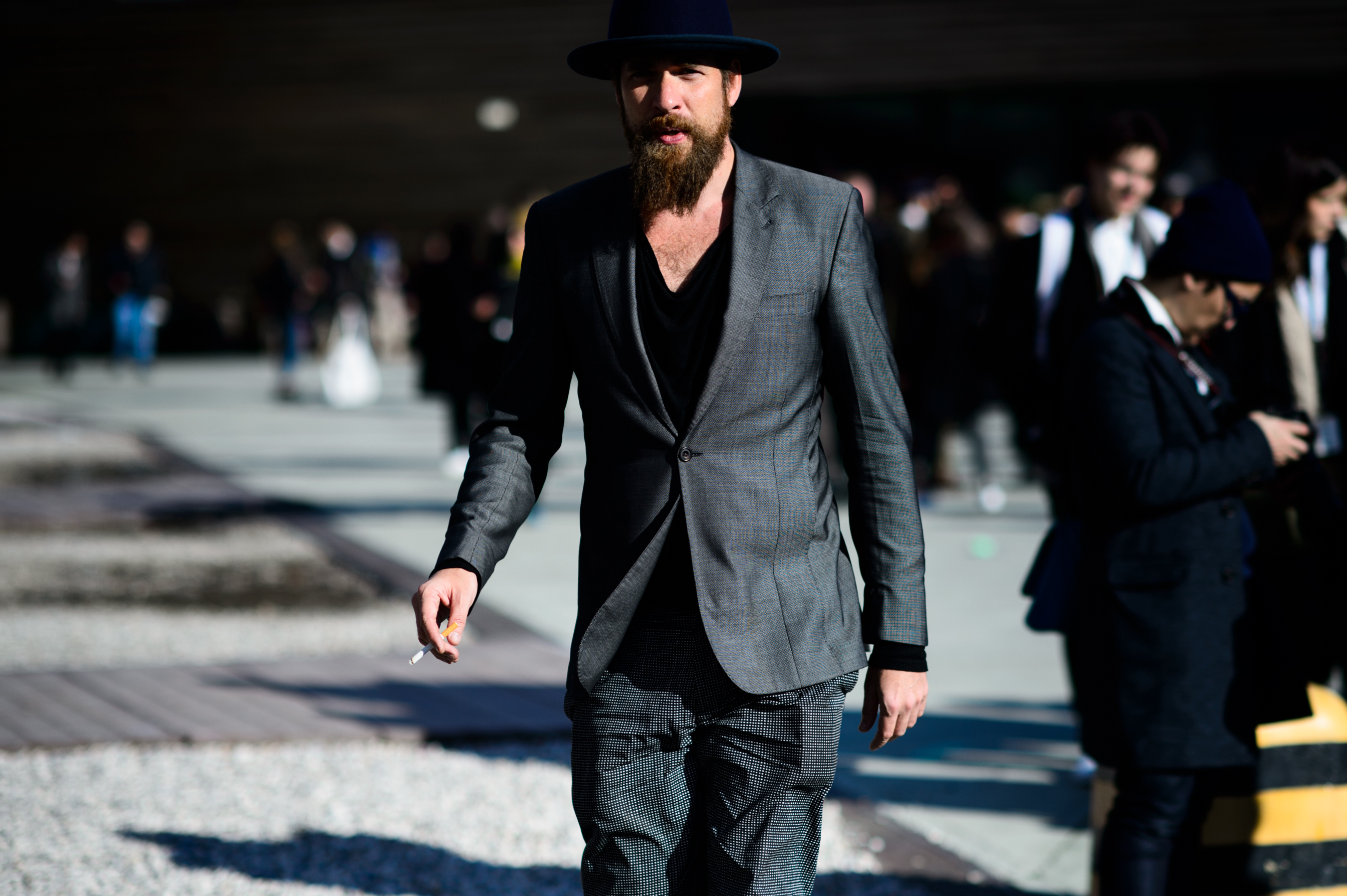 Man wearing grey suit at Pitti Uomo