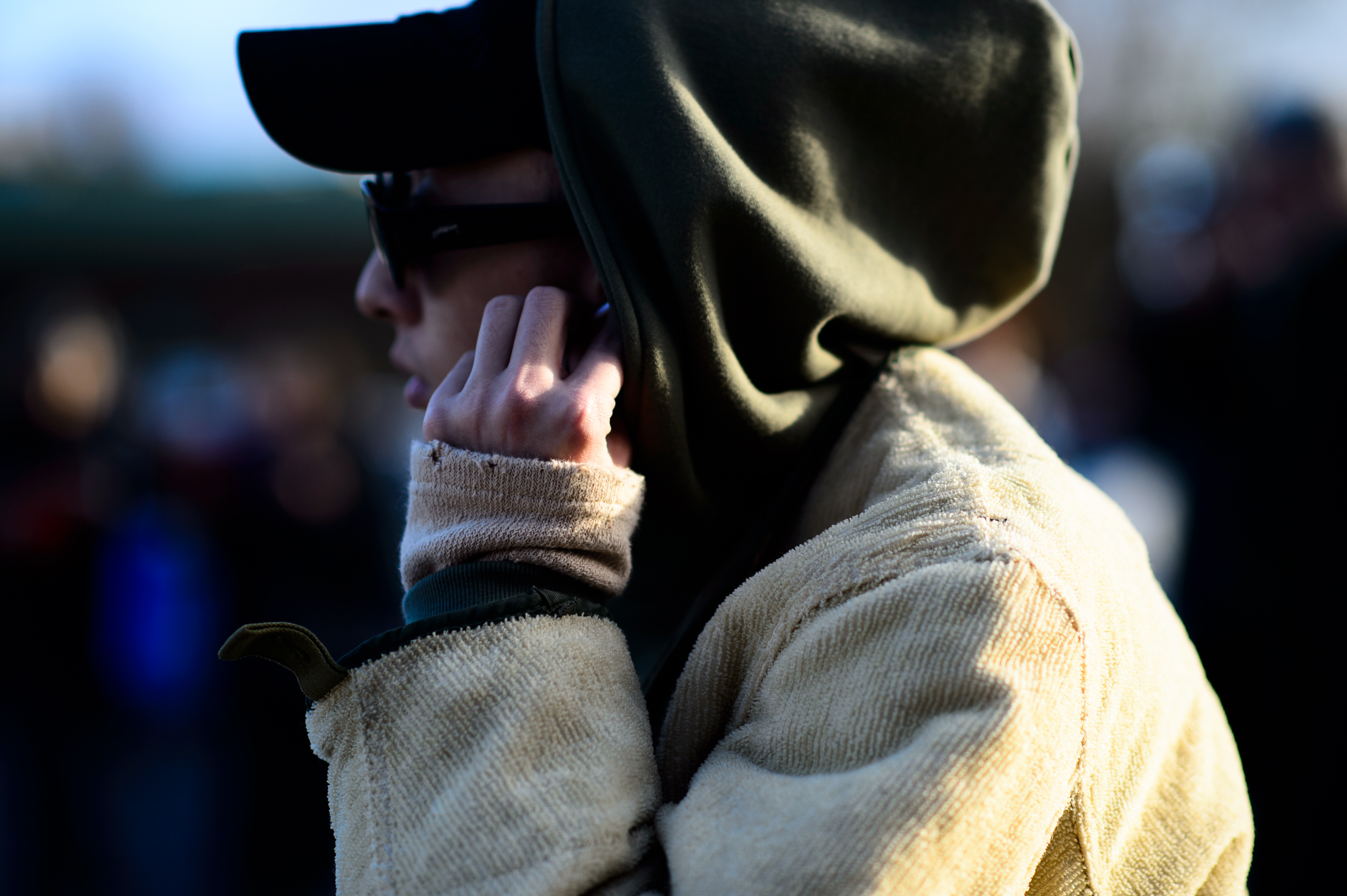 Korean photographer wearing hood and cap