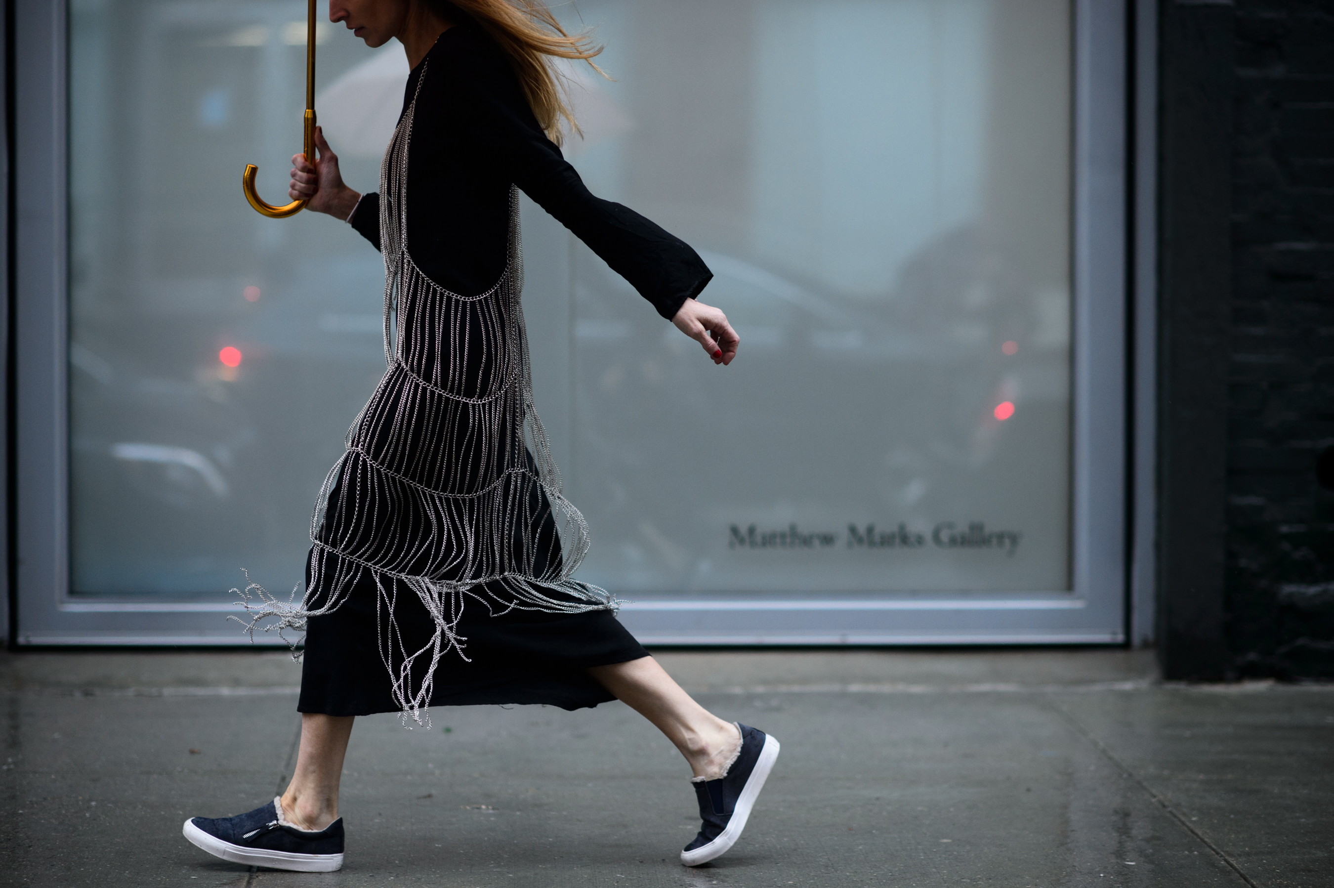 Blogger with umbrella chain dress