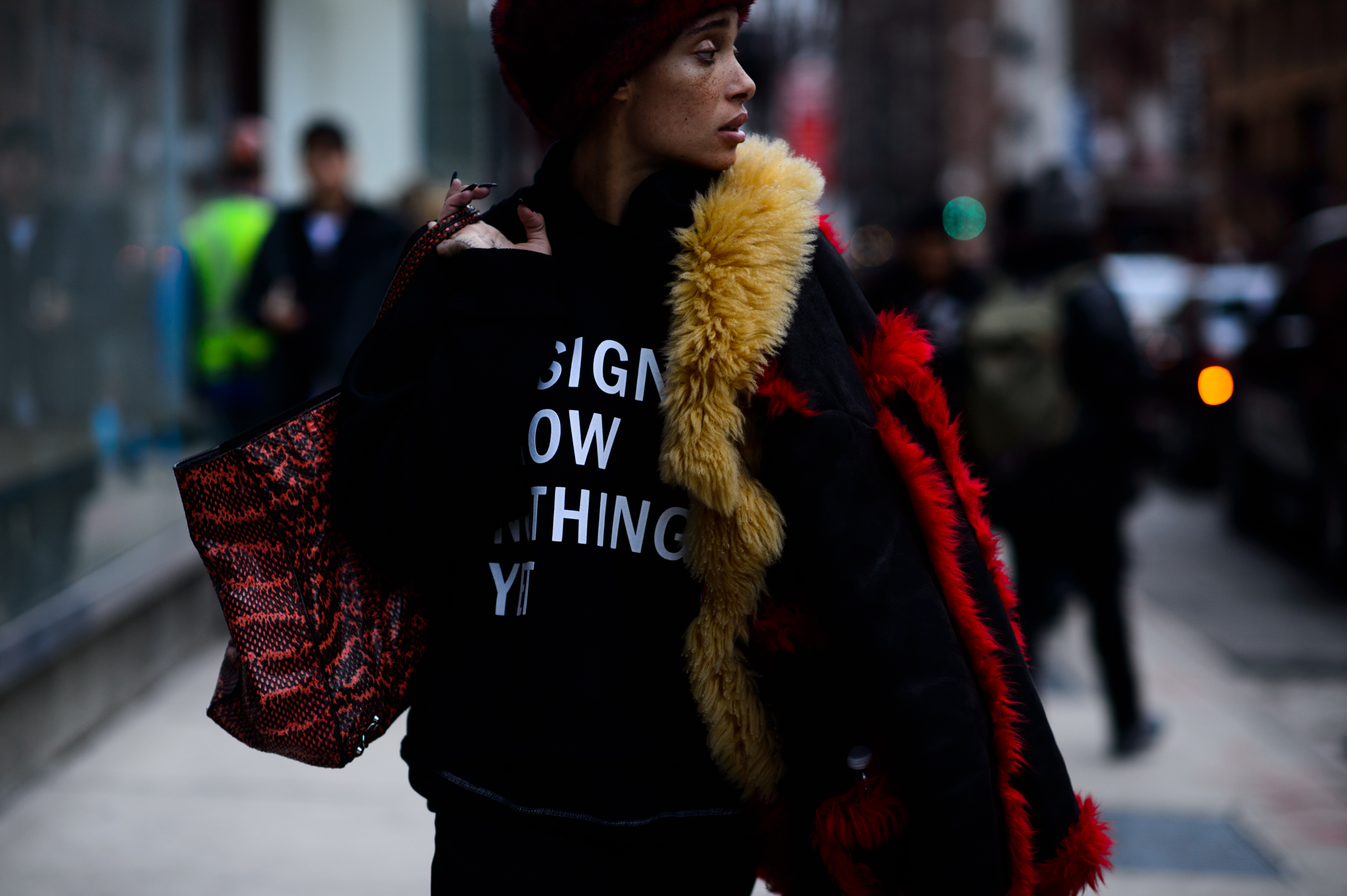 Model holding Prada jacket