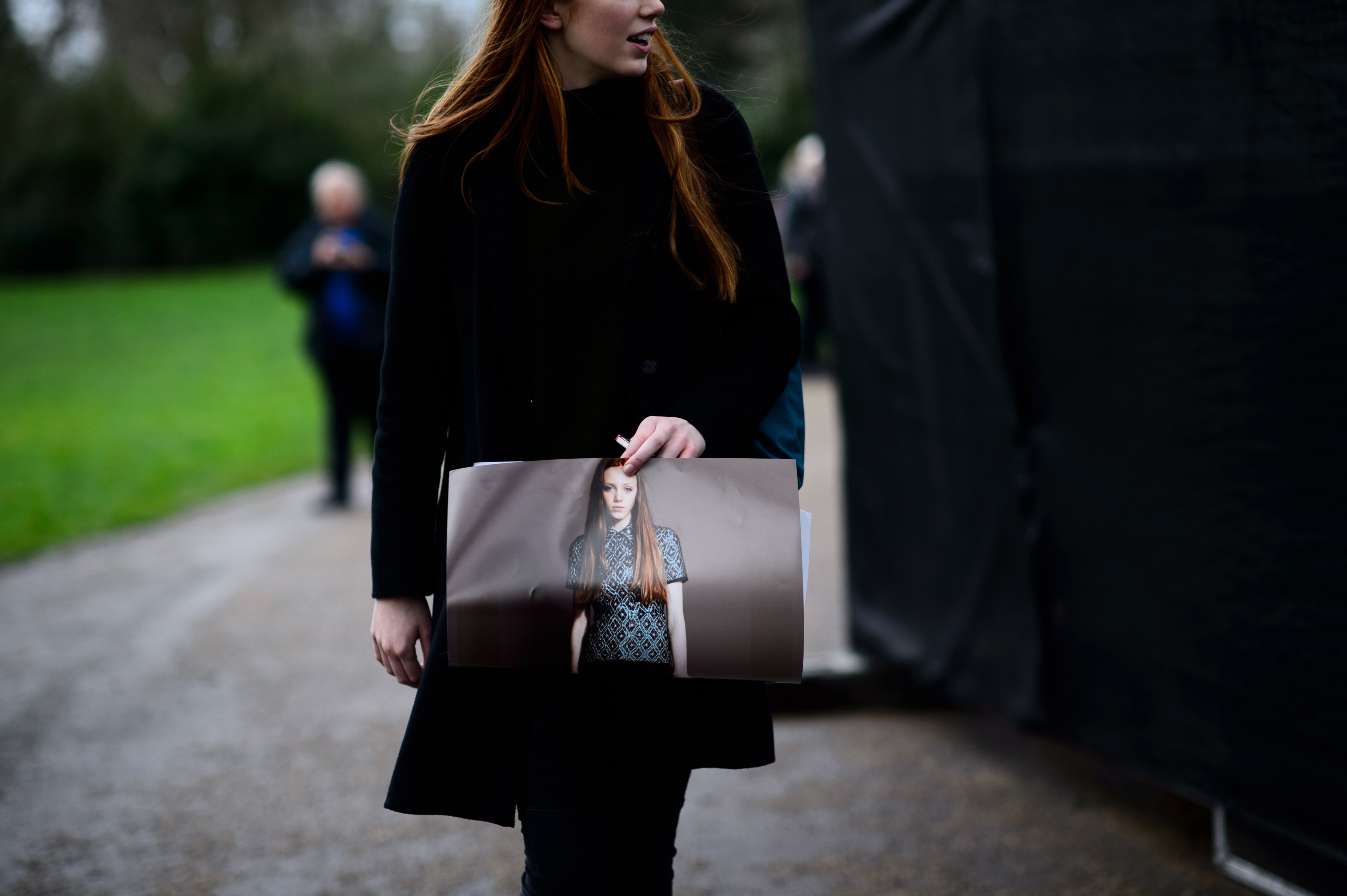 Model with red hair after the show