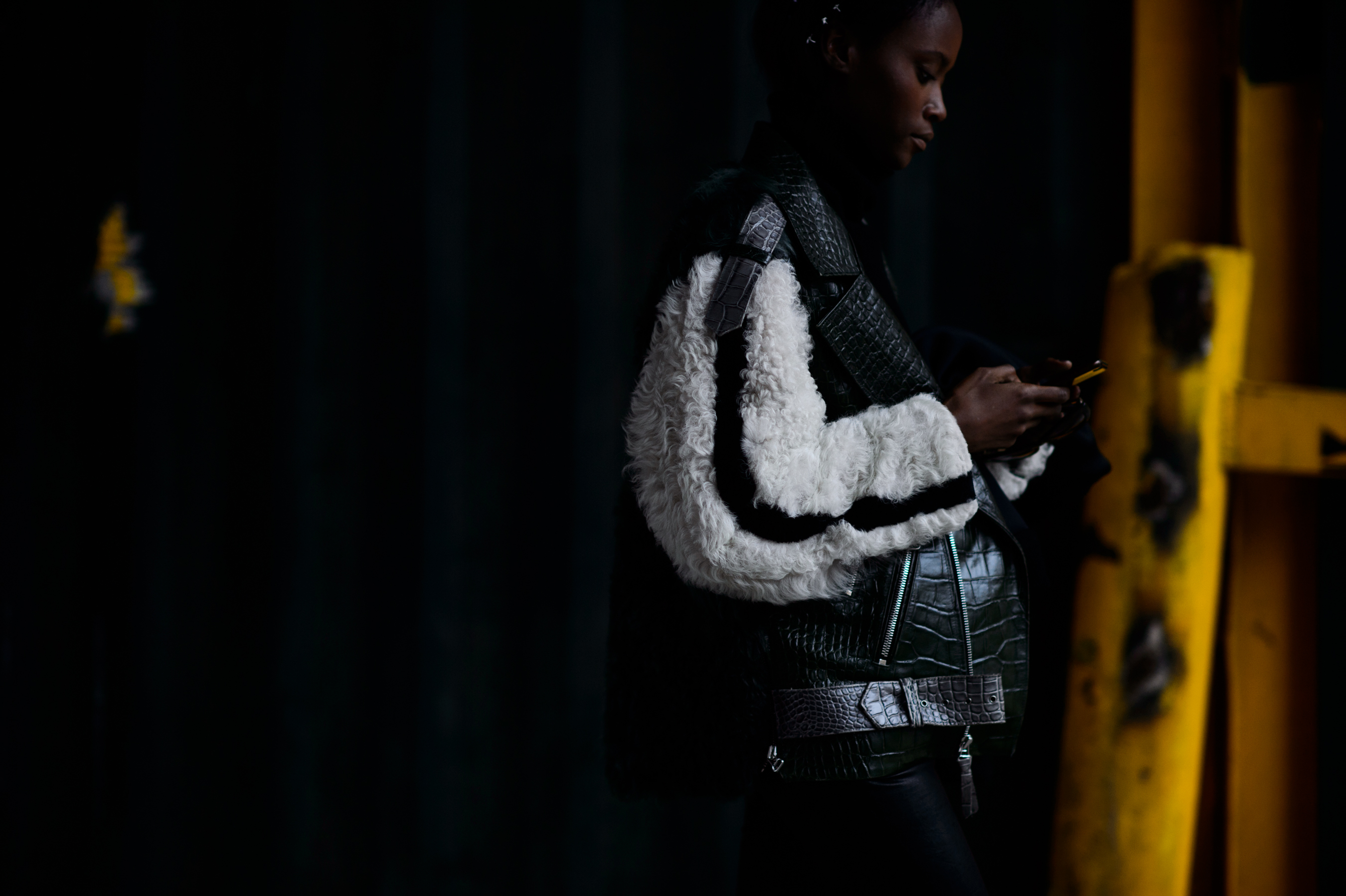 Model wearing furry sleeve jacket