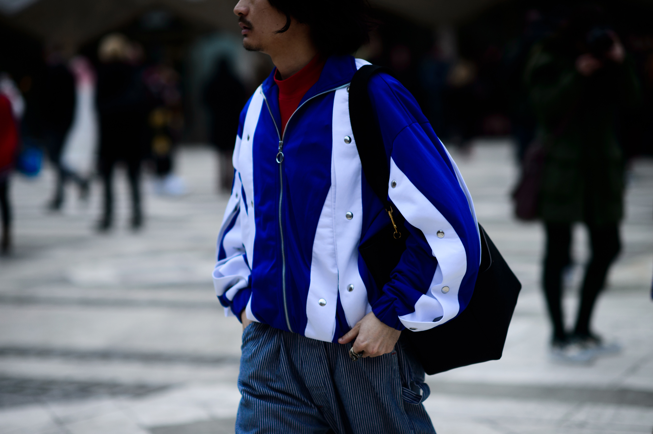 Man wearing blue and white jacket