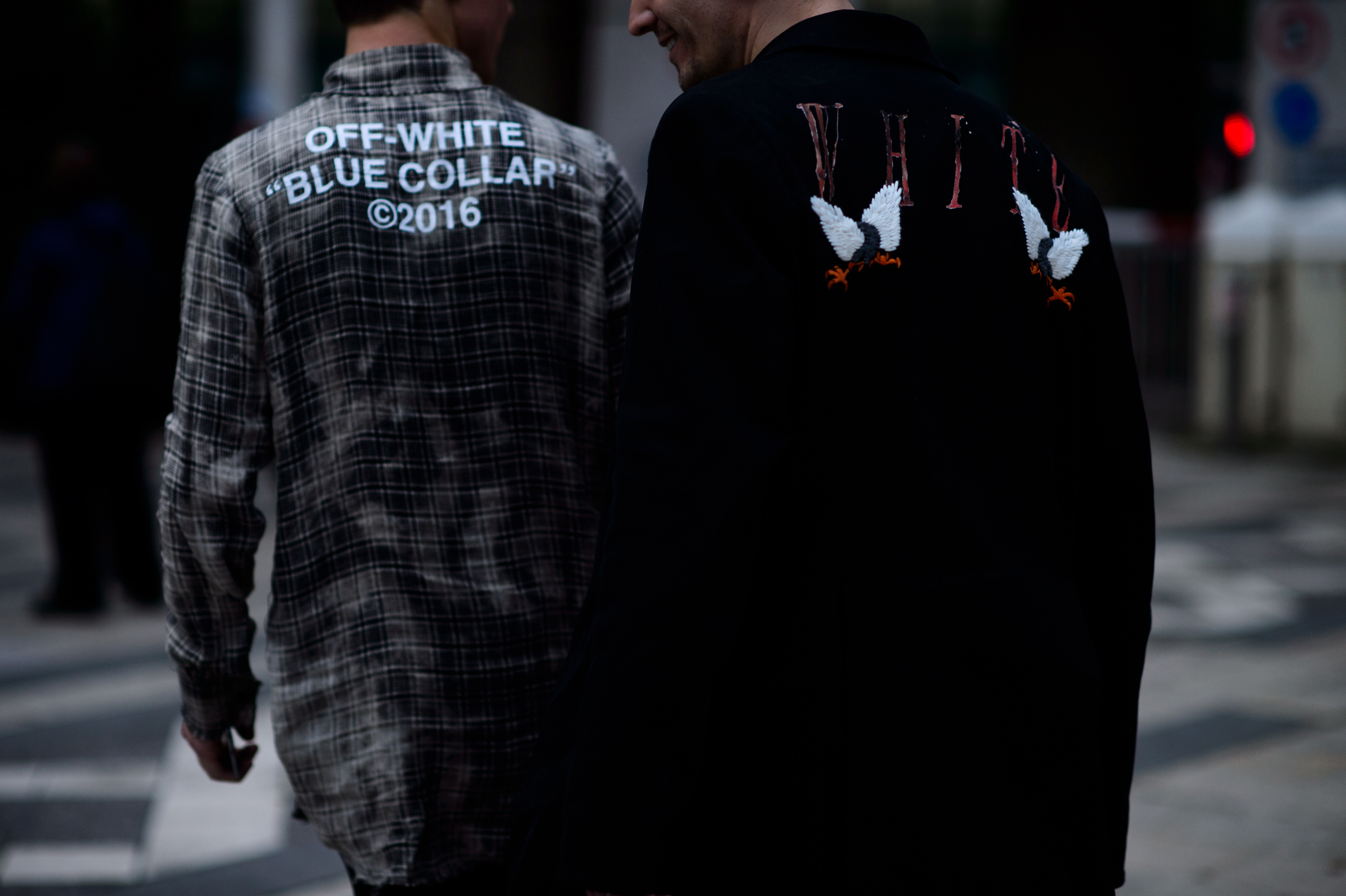 Two men wearing off-white coats