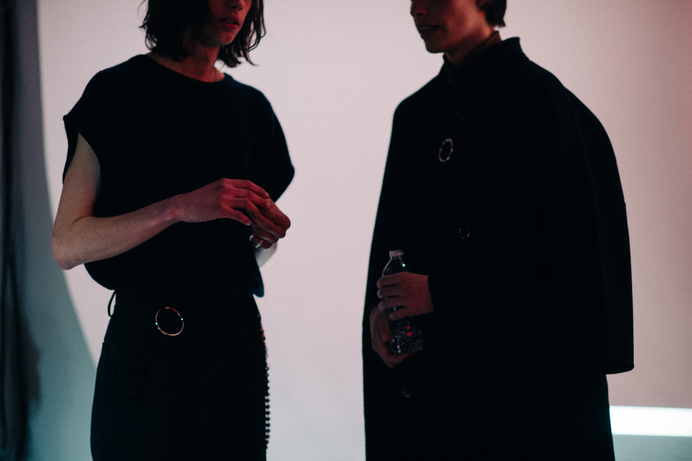 Two male models wearing black