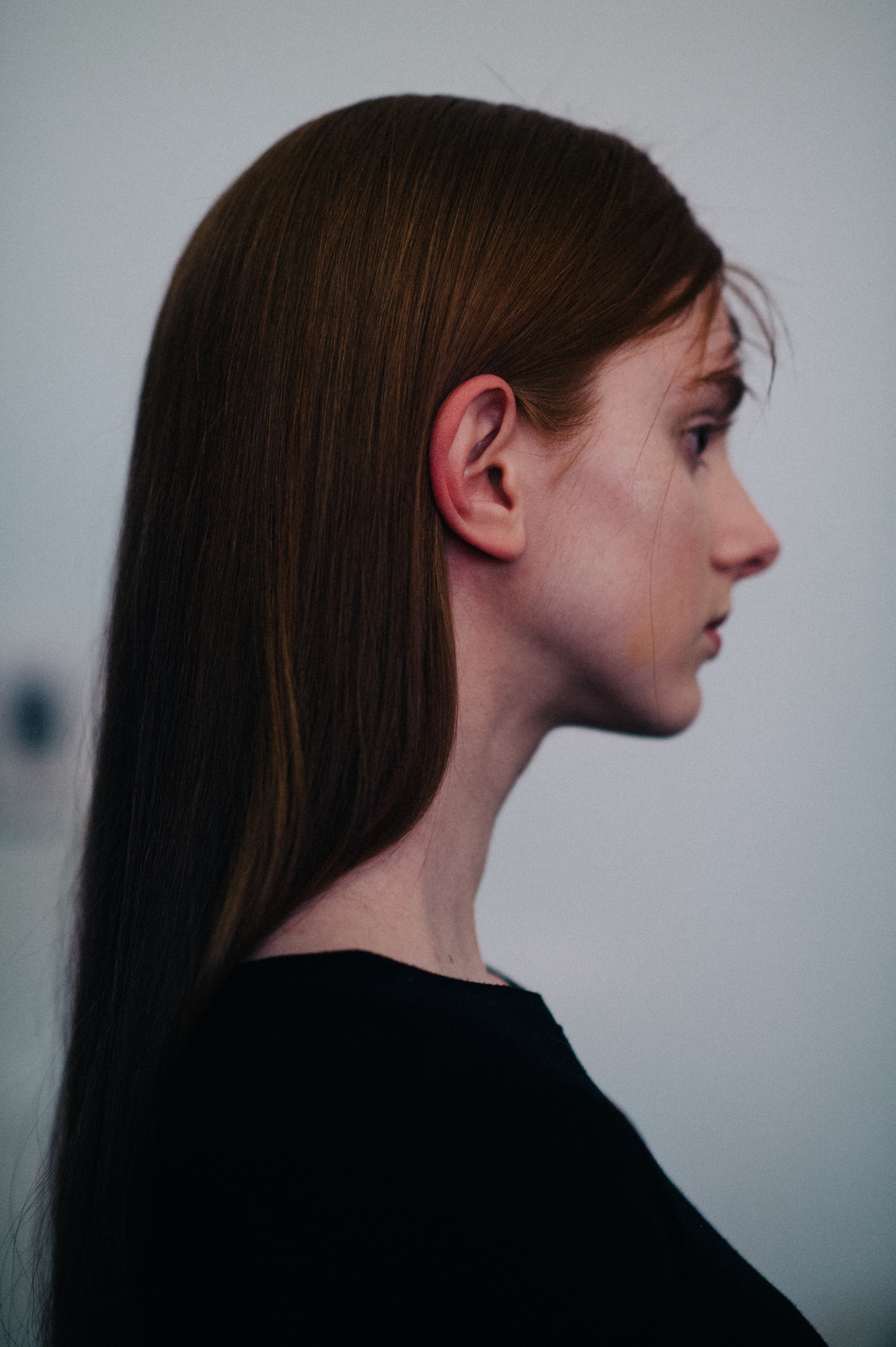 Model with red hair side portrait