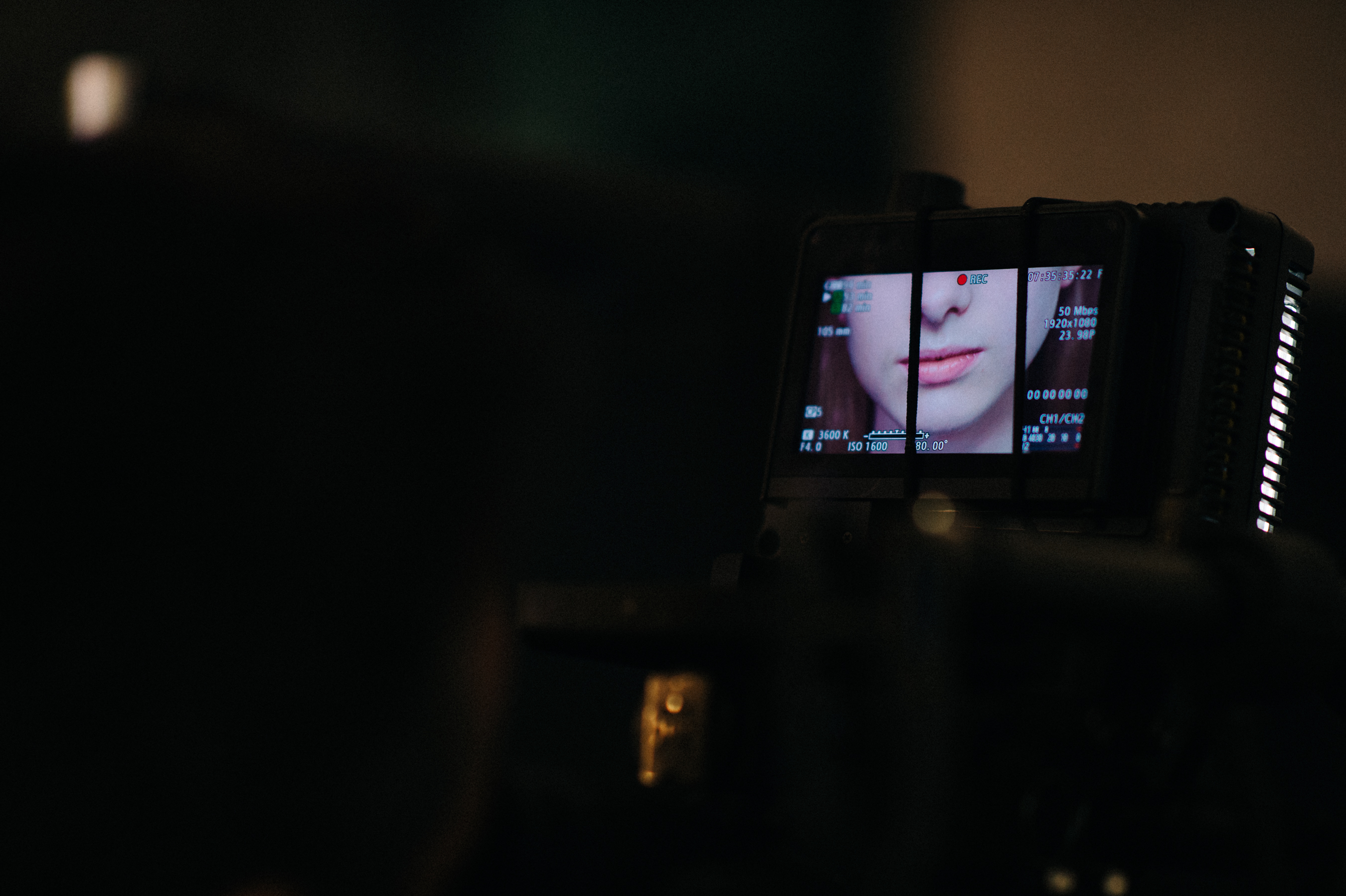 Photo of a screen filming a model