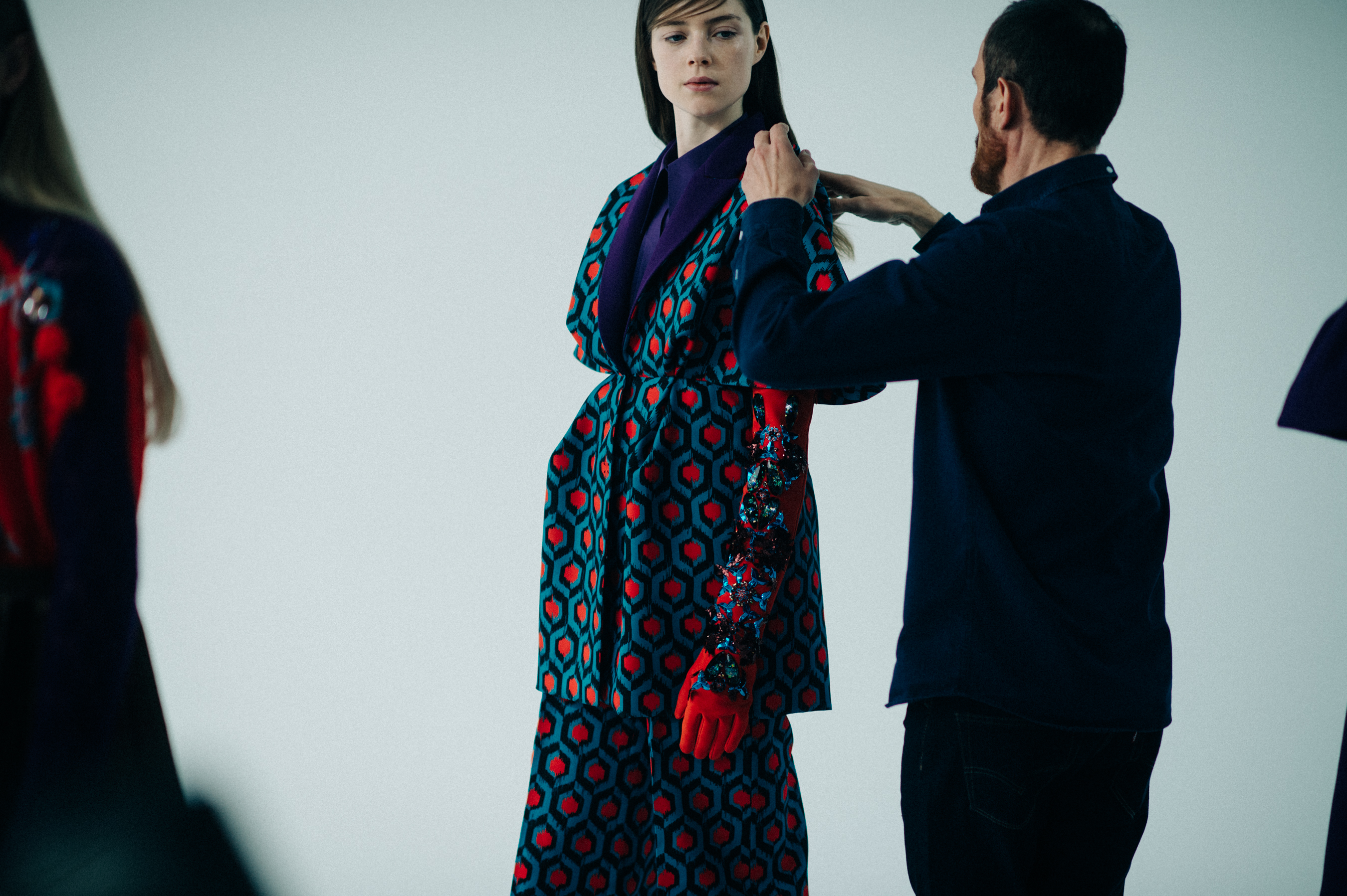 British model getting dressed by designer