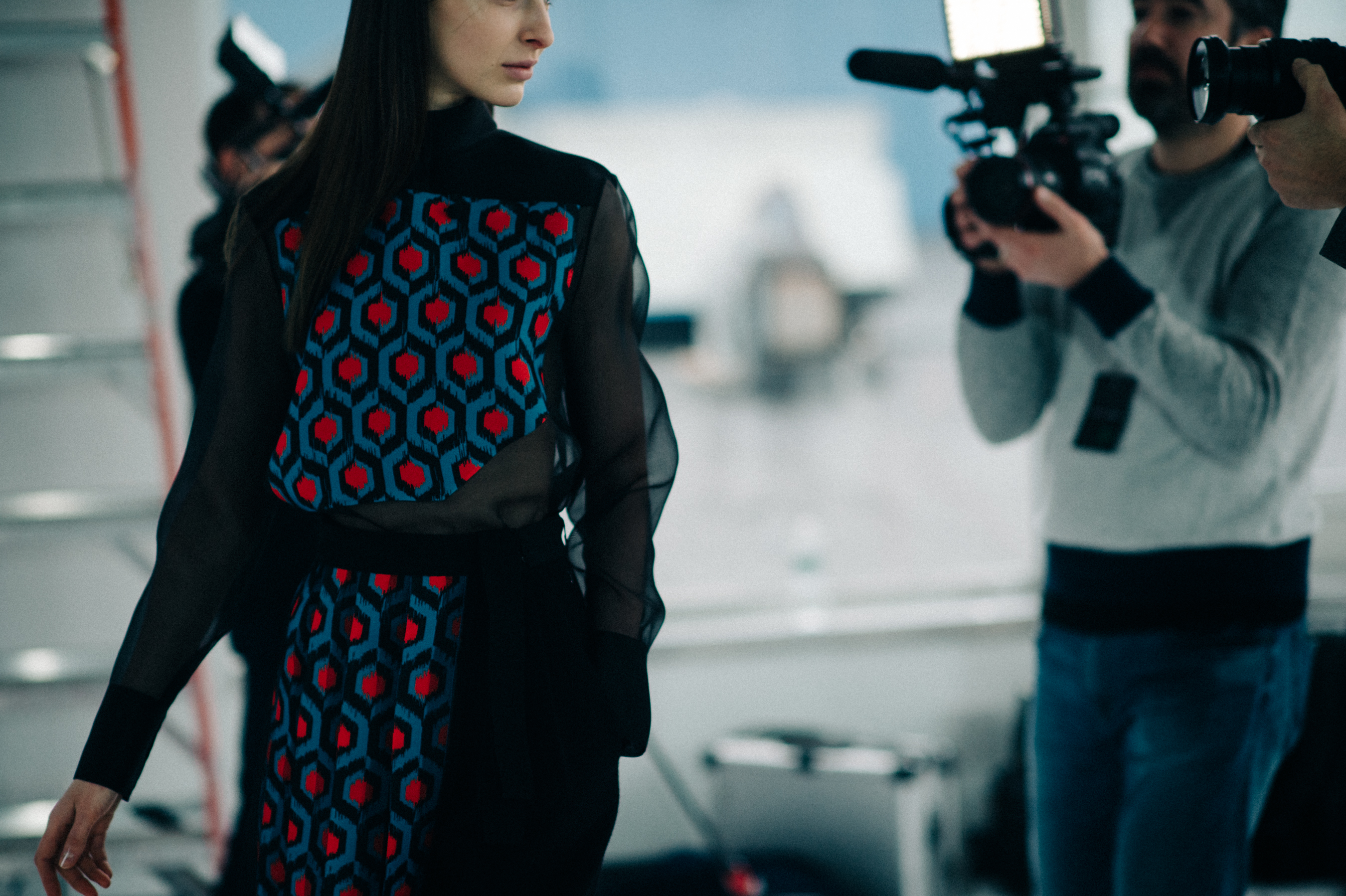 Model wearing blue detail dress