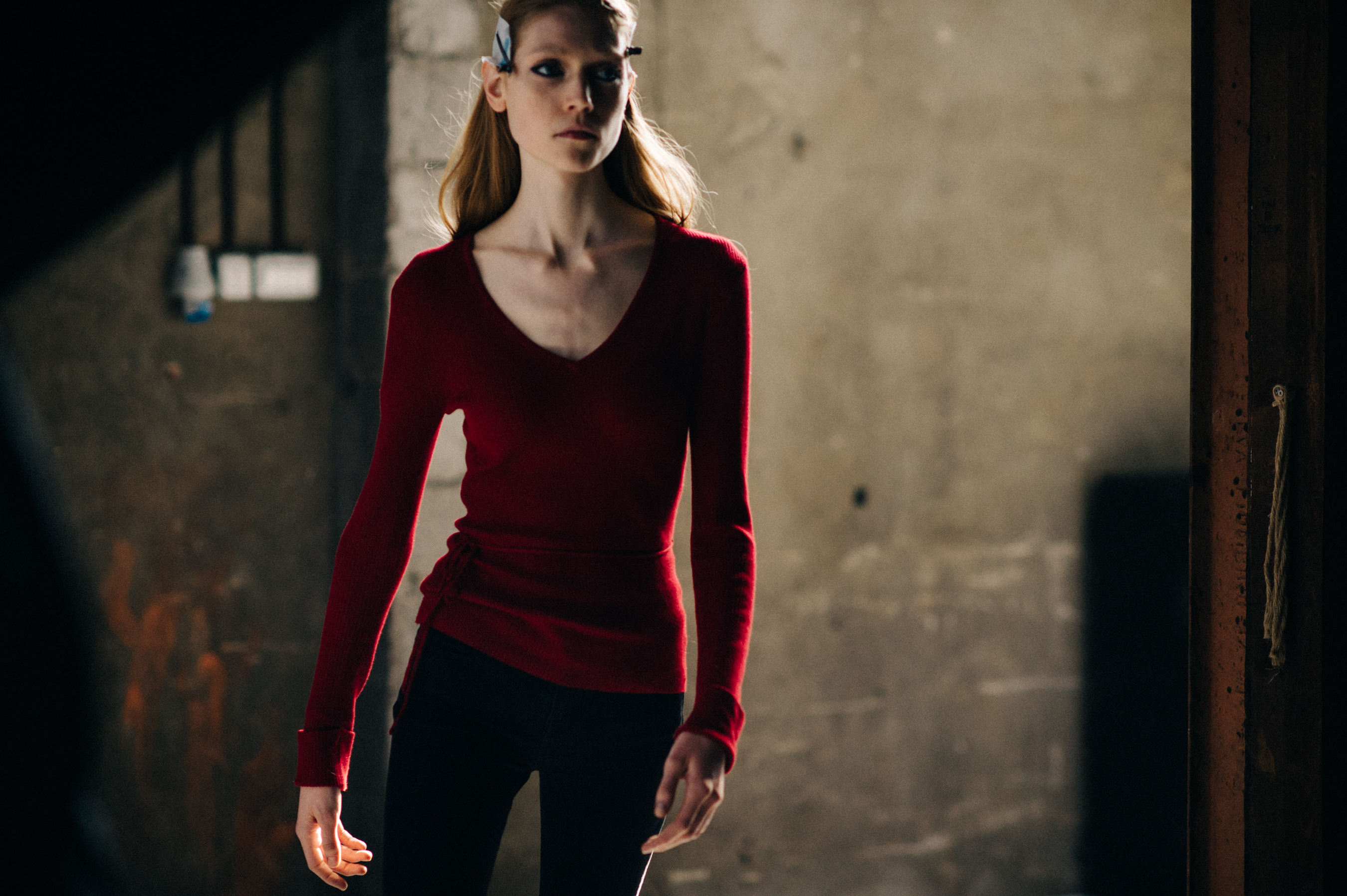 Model wearing red at the rehearsal