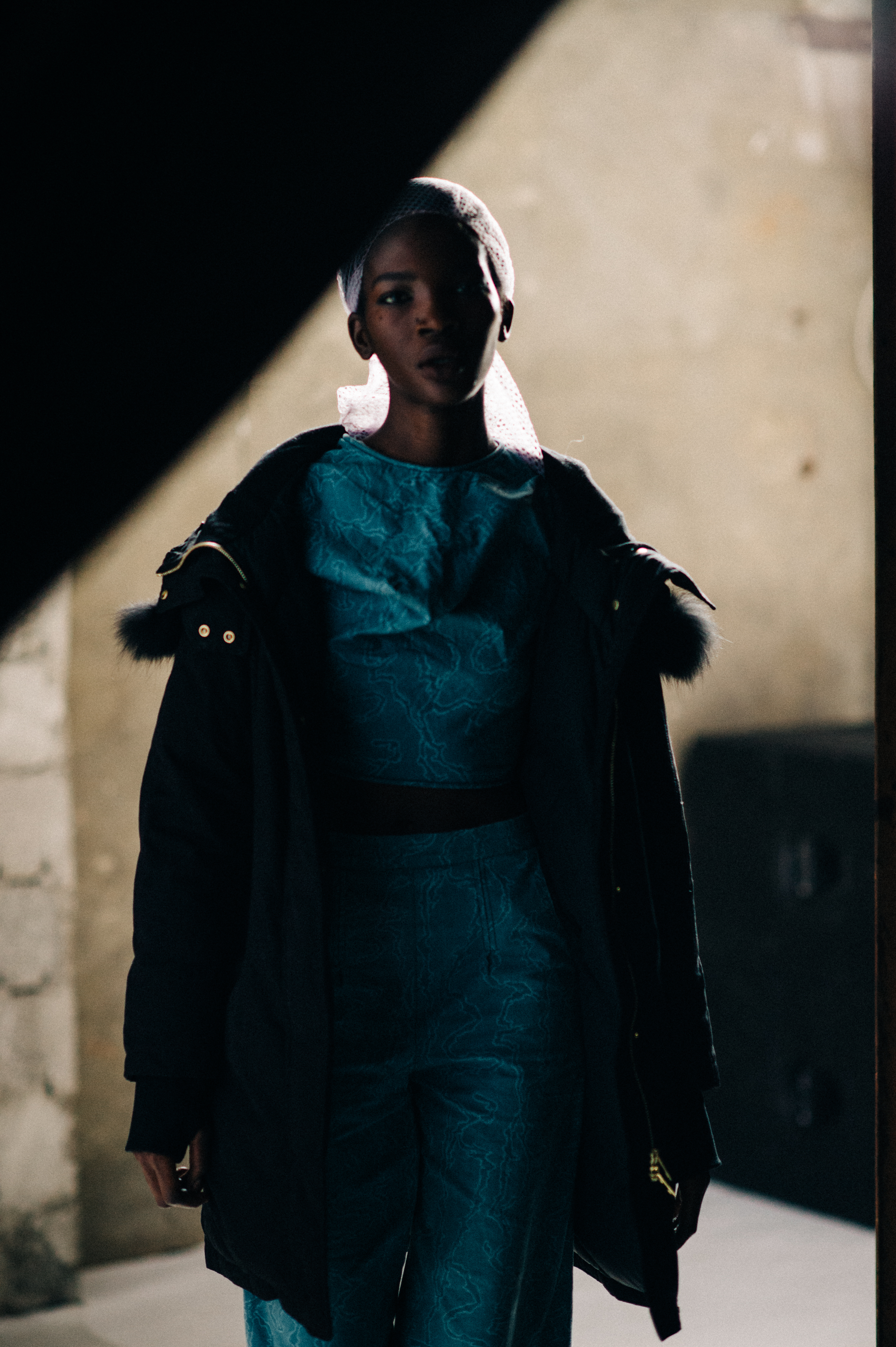 Model wearing blue outfit