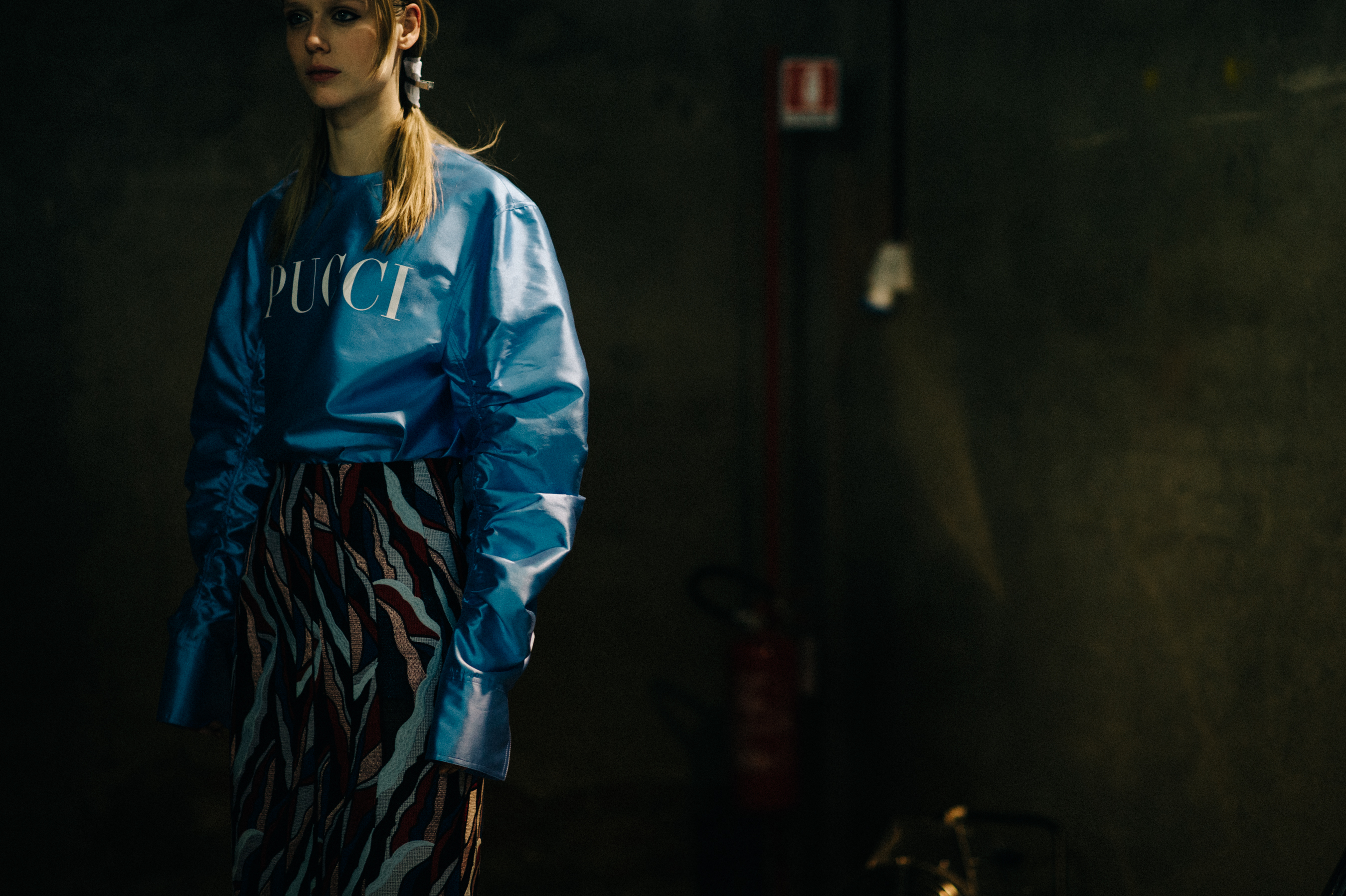 Model wearing blue oversized bomber