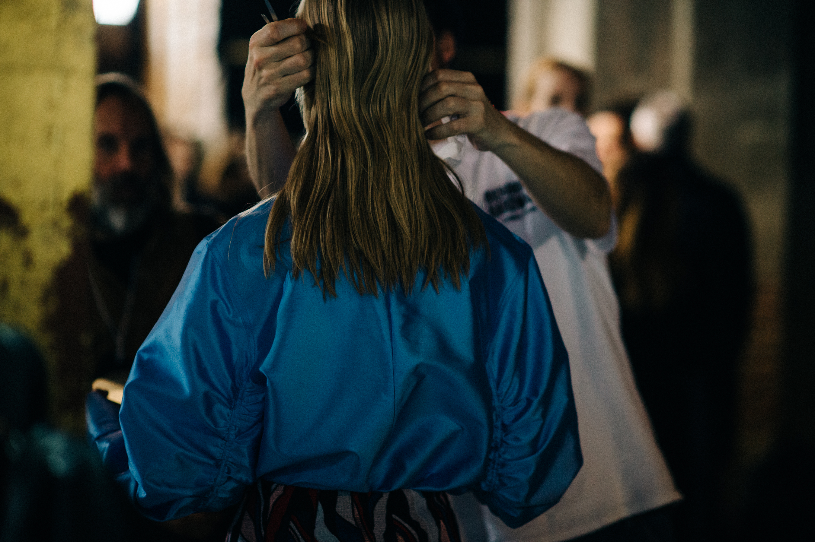 Model getting hair done before show