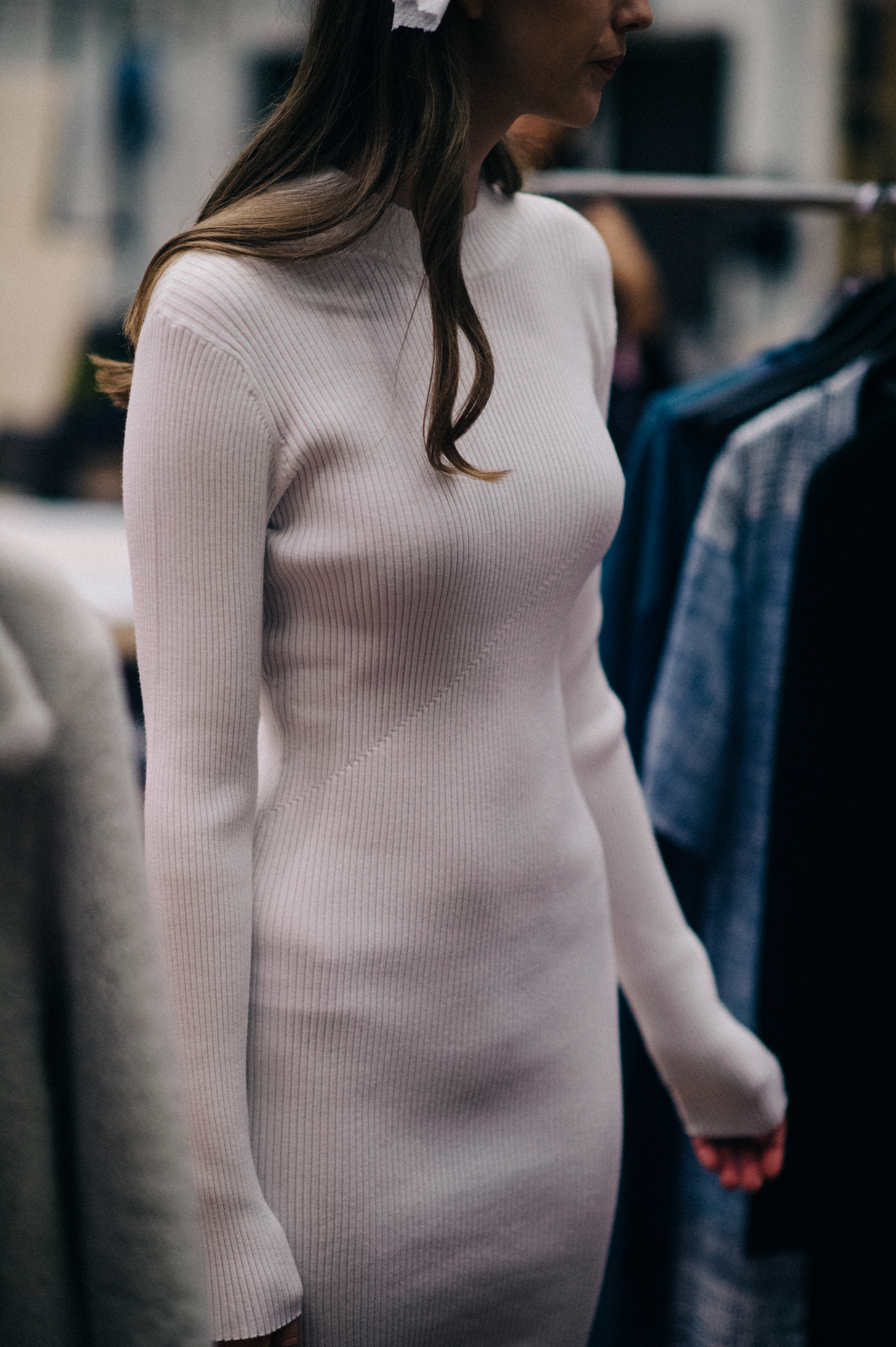 Model wearing white sweater